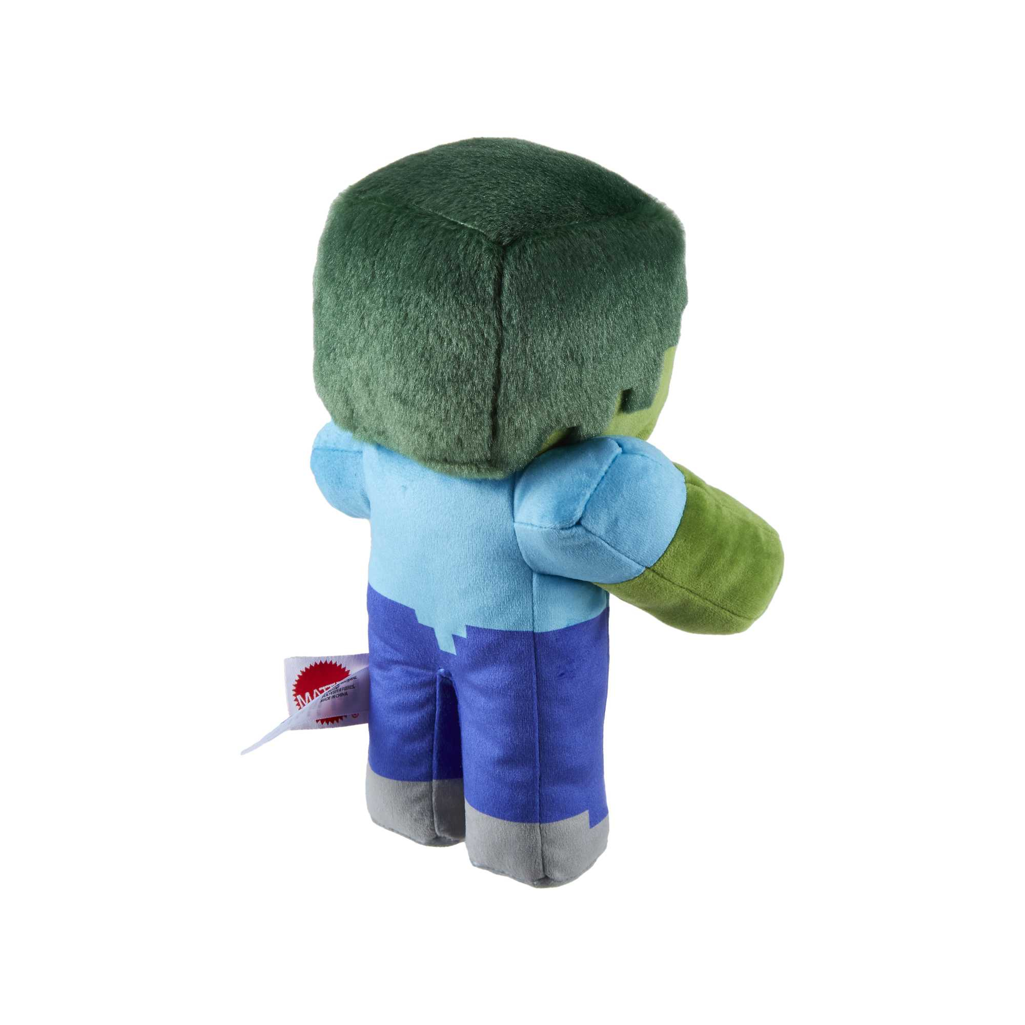 Ein grünes Zombie-Minecraft-Plüschtier, das auf einer weißen Oberfläche steht. Es hat ein Etikett angebracht.
