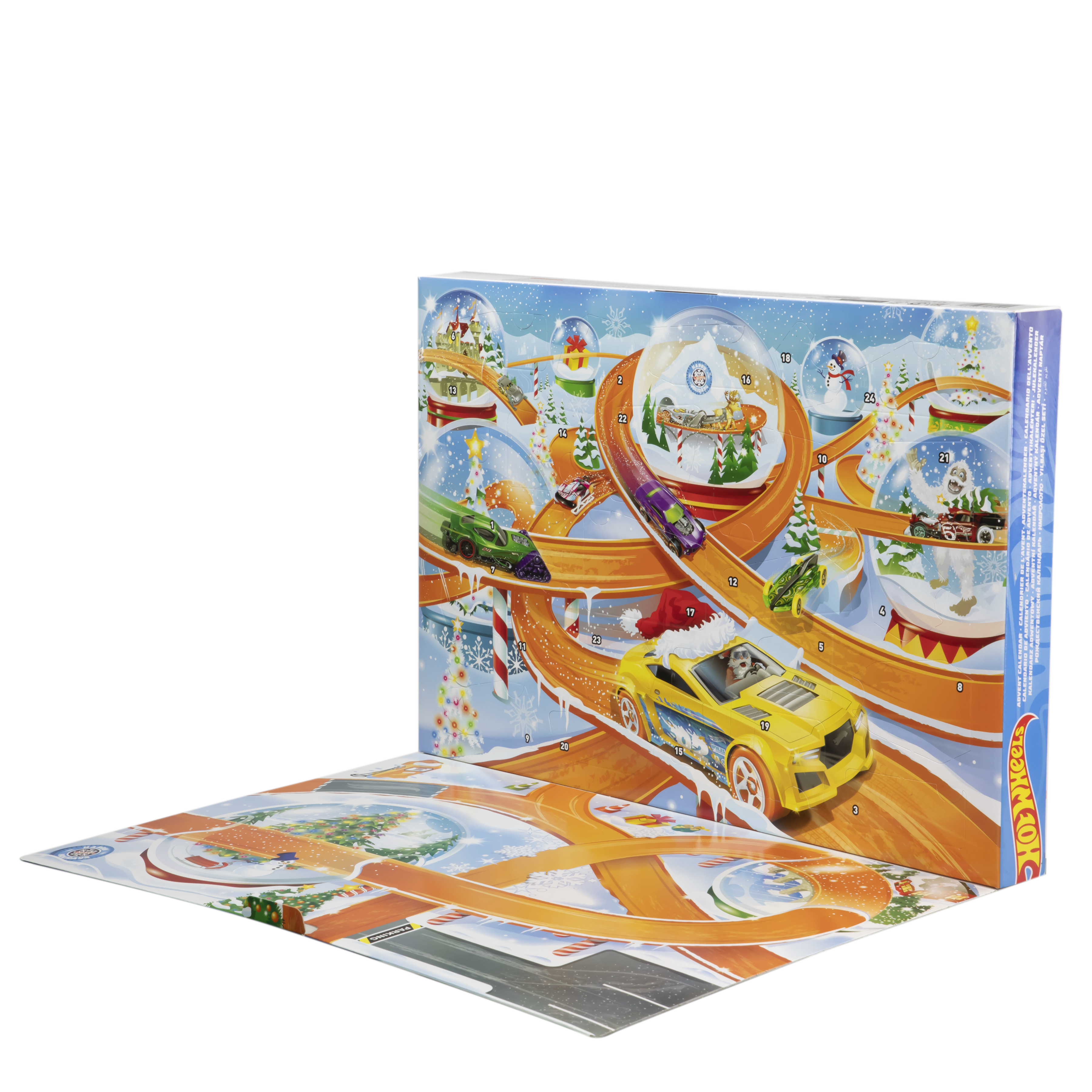 Un calendario de adviento de Hot Wheels está abierto, mostrando una pista de carreras y coches de juguete en bolas de nieve y en la pista.