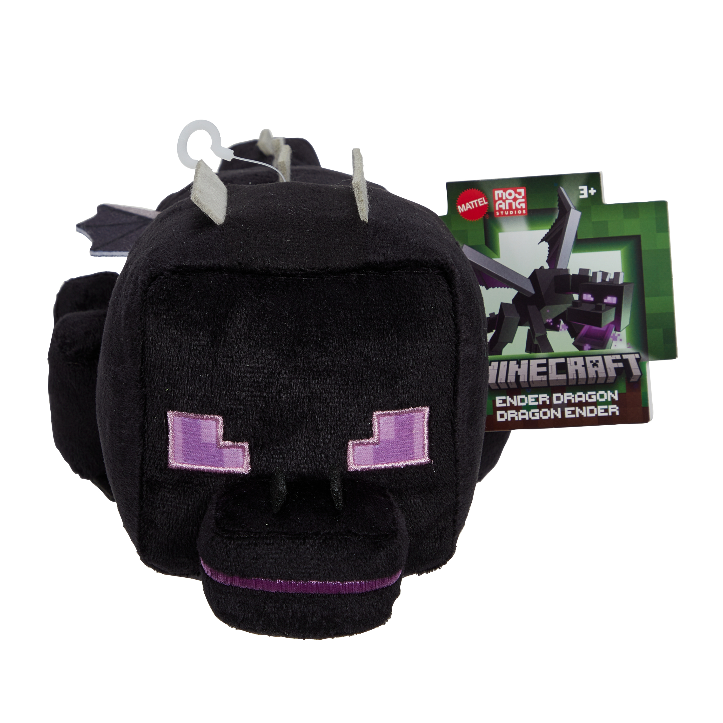 Un peluche del dragón Ender de Minecraft con una etiqueta, sobre un fondo blanco.
