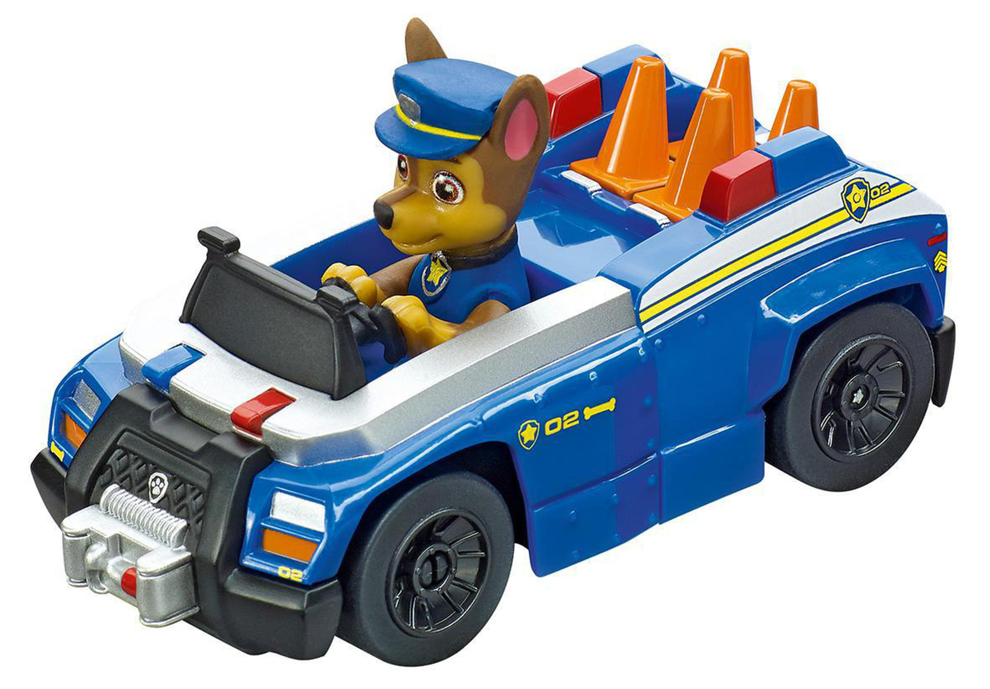 A blue police car with a dog in the driver's seat, wearing a police hat, and cones on the back.