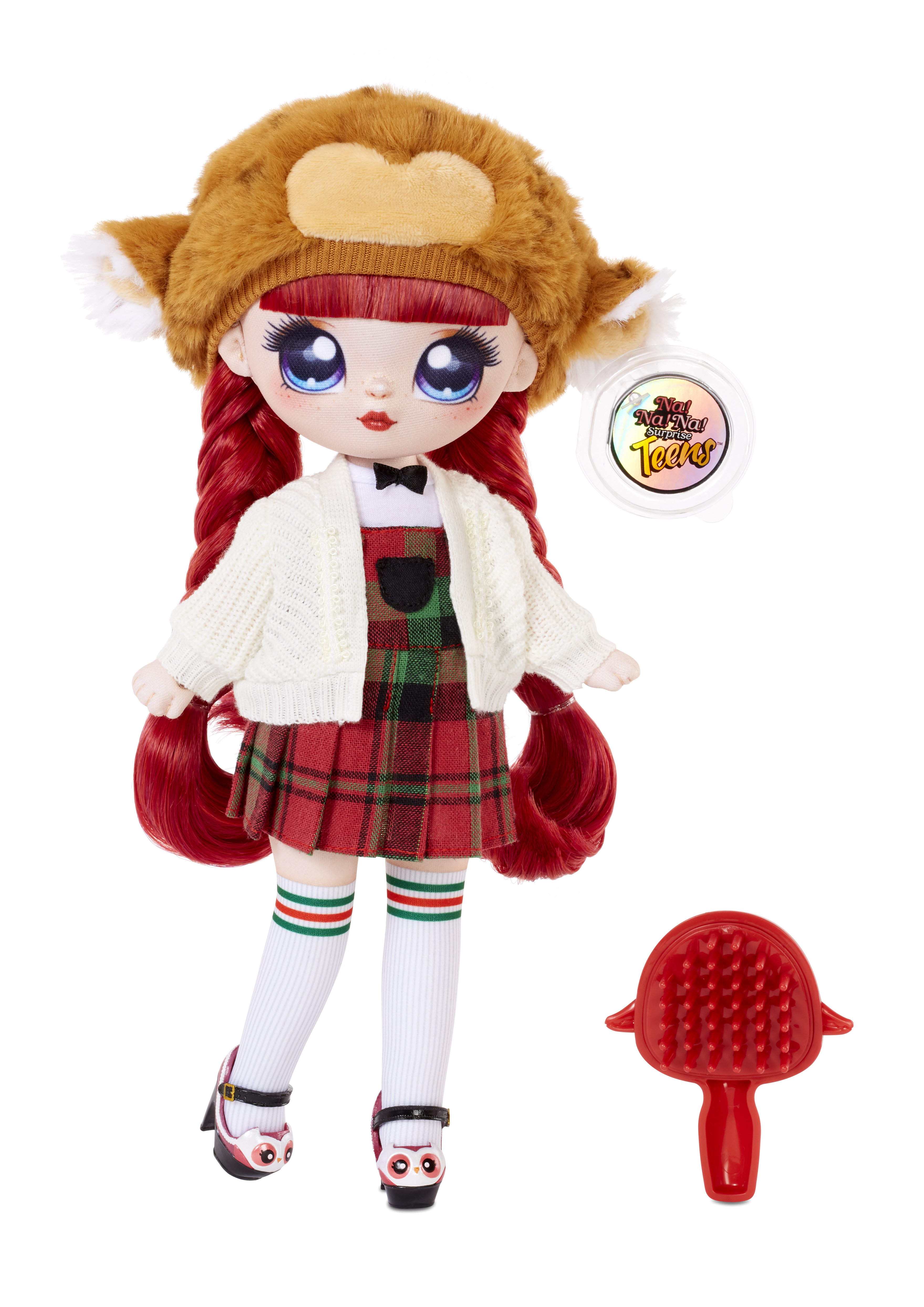 Lalka z rudymi włosami, w kapeluszu i kraciastej spódnicy. Czerwona szczotka obok.