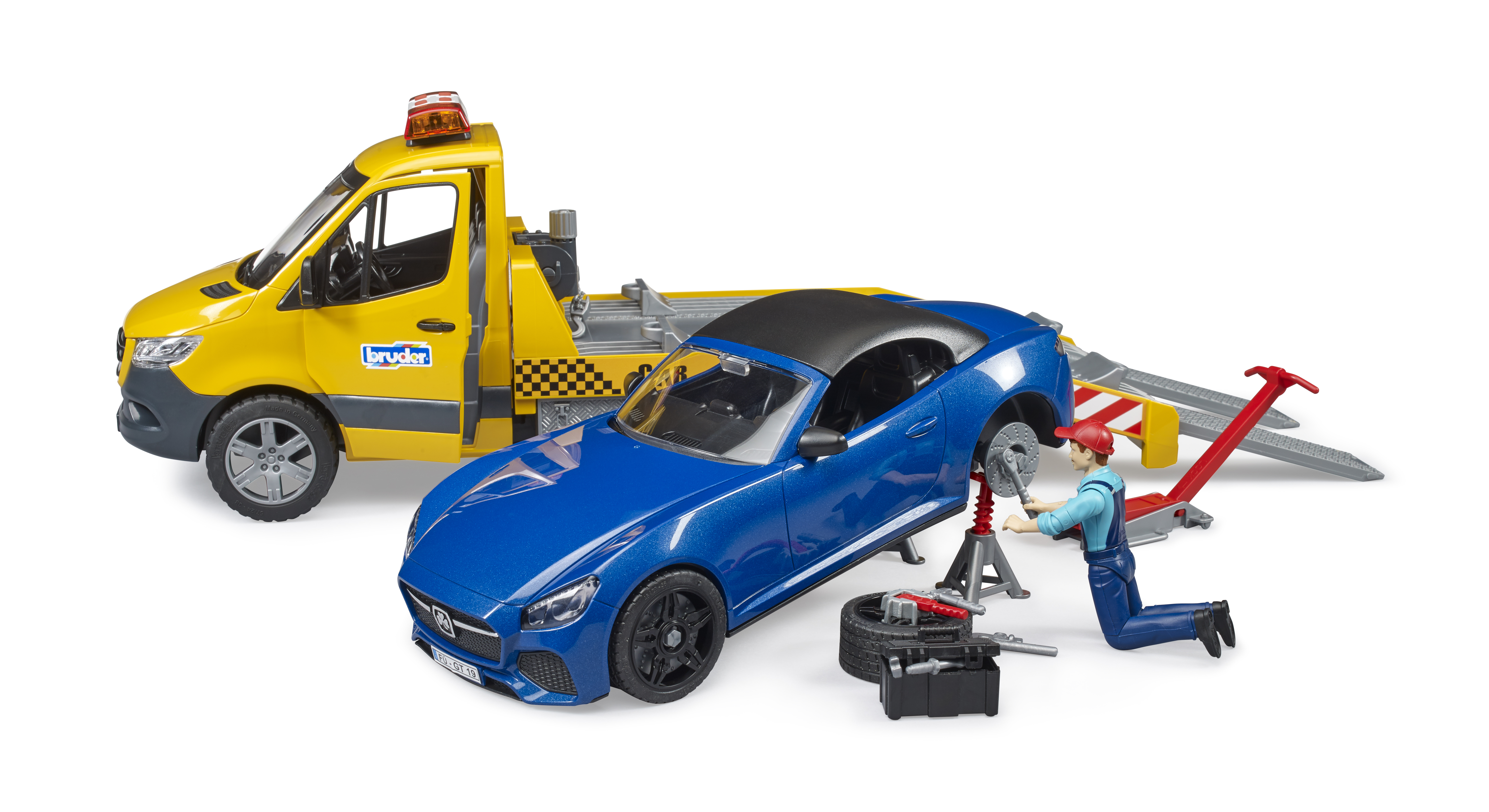 Eine Spielzeug-Autoreparatur-Szene mit einem blauen Auto, an dem gearbeitet wird. Es gibt einen Abschleppwagen und eine Mechanikerfigur.