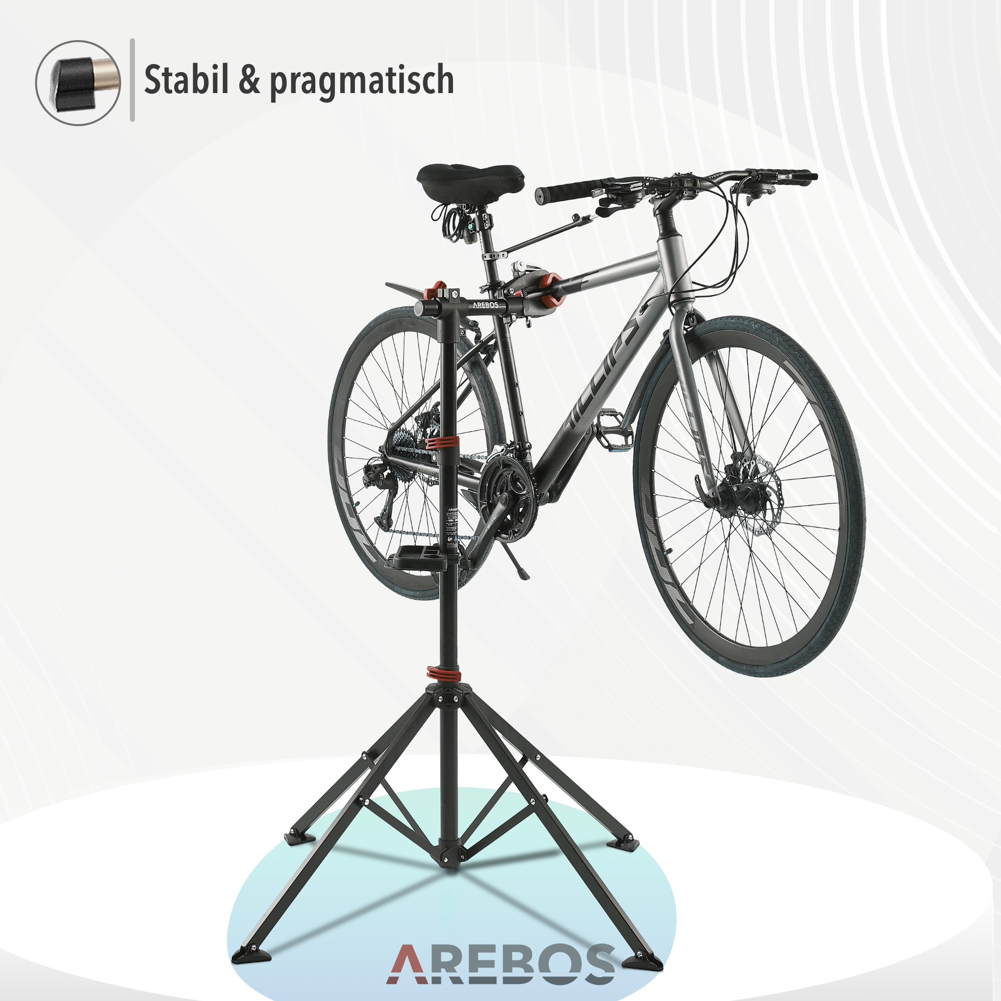 Ein schwarzes Fahrrad steht auf einem Ständer. Der Hintergrund ist weiß mit AREBOS-Logo.