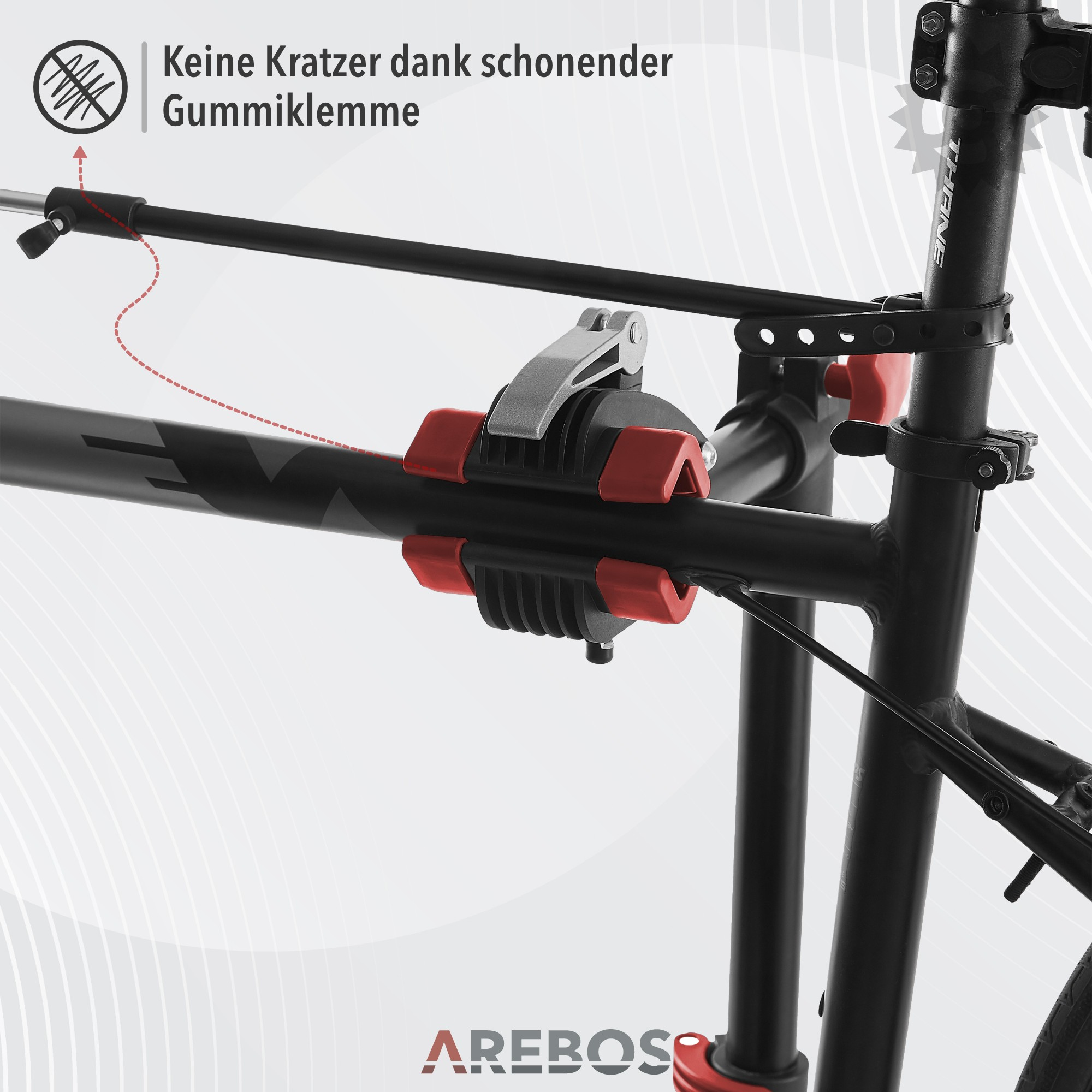 Ein schwarzer Metall-Fahrradständer mit roten Gummi-Klemmen. Text: Keine Kratzer dank Gummi-Klemme.