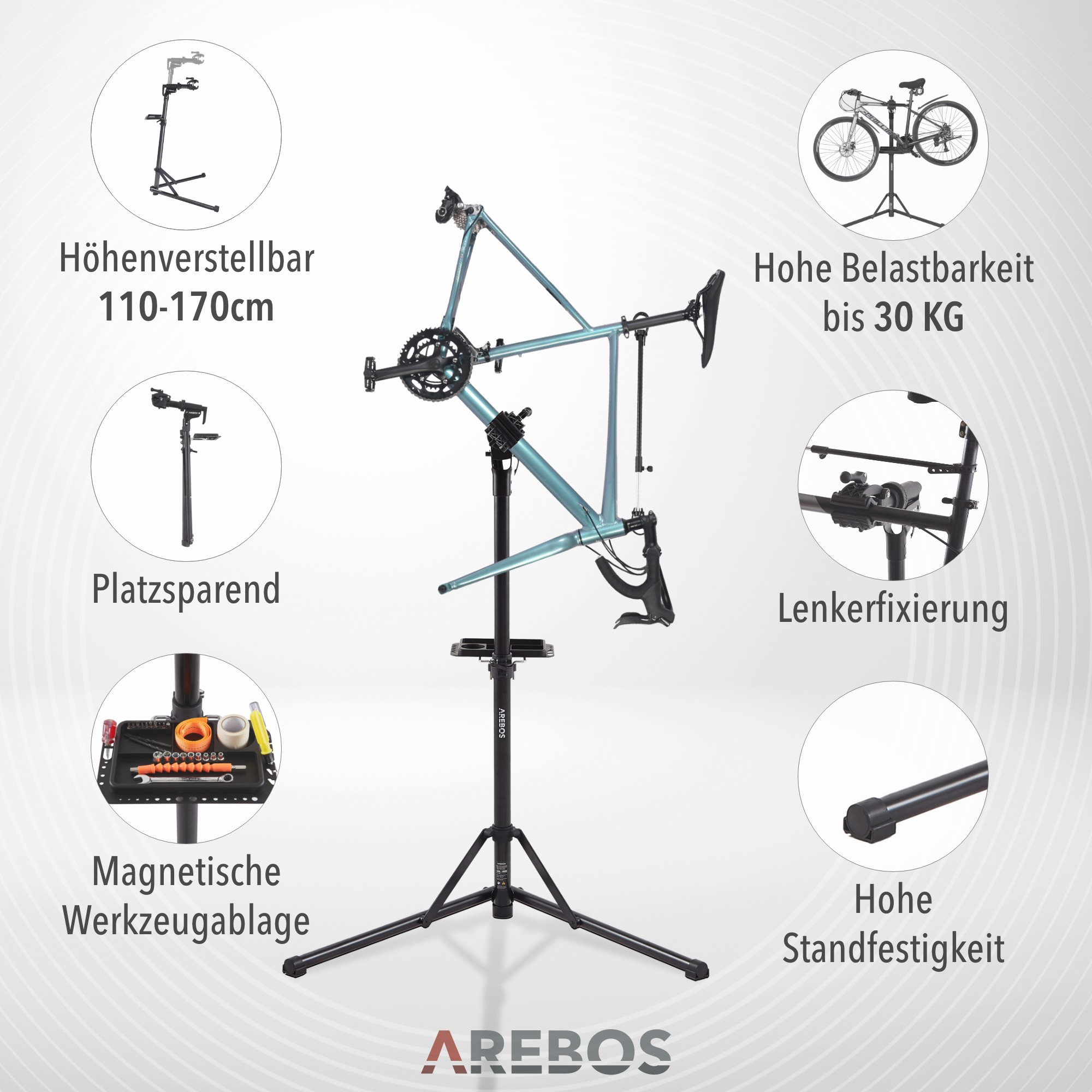 Ein Fahrradreparaturständer mit einem Fahrrad darauf. Werkzeuge befinden sich auf einer Ablage. Etiketten beschreiben Merkmale.
