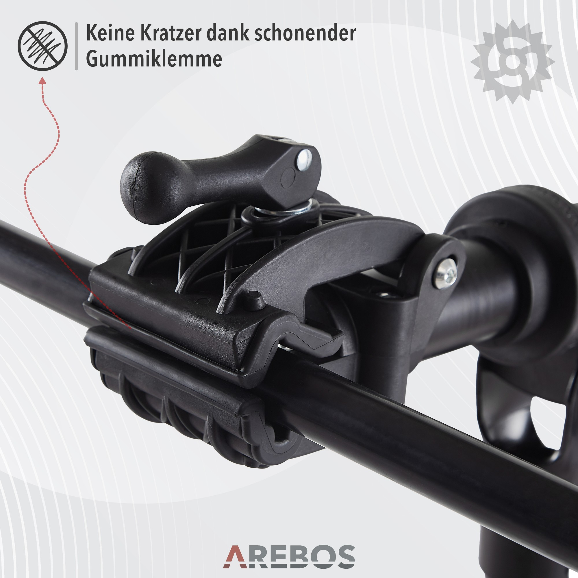Schwarze Klemme mit Hebel, an einer schwarzen Stange befestigt, mit deutschem Text.