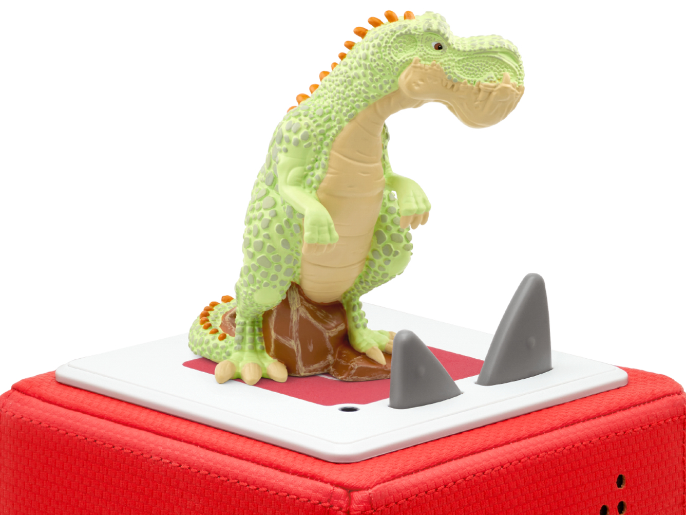 Grünes Dinosaurierspielzeug auf roter Basis mit grauen Stacheln. Der Dinosaurier hat orangefarbene Akzente.