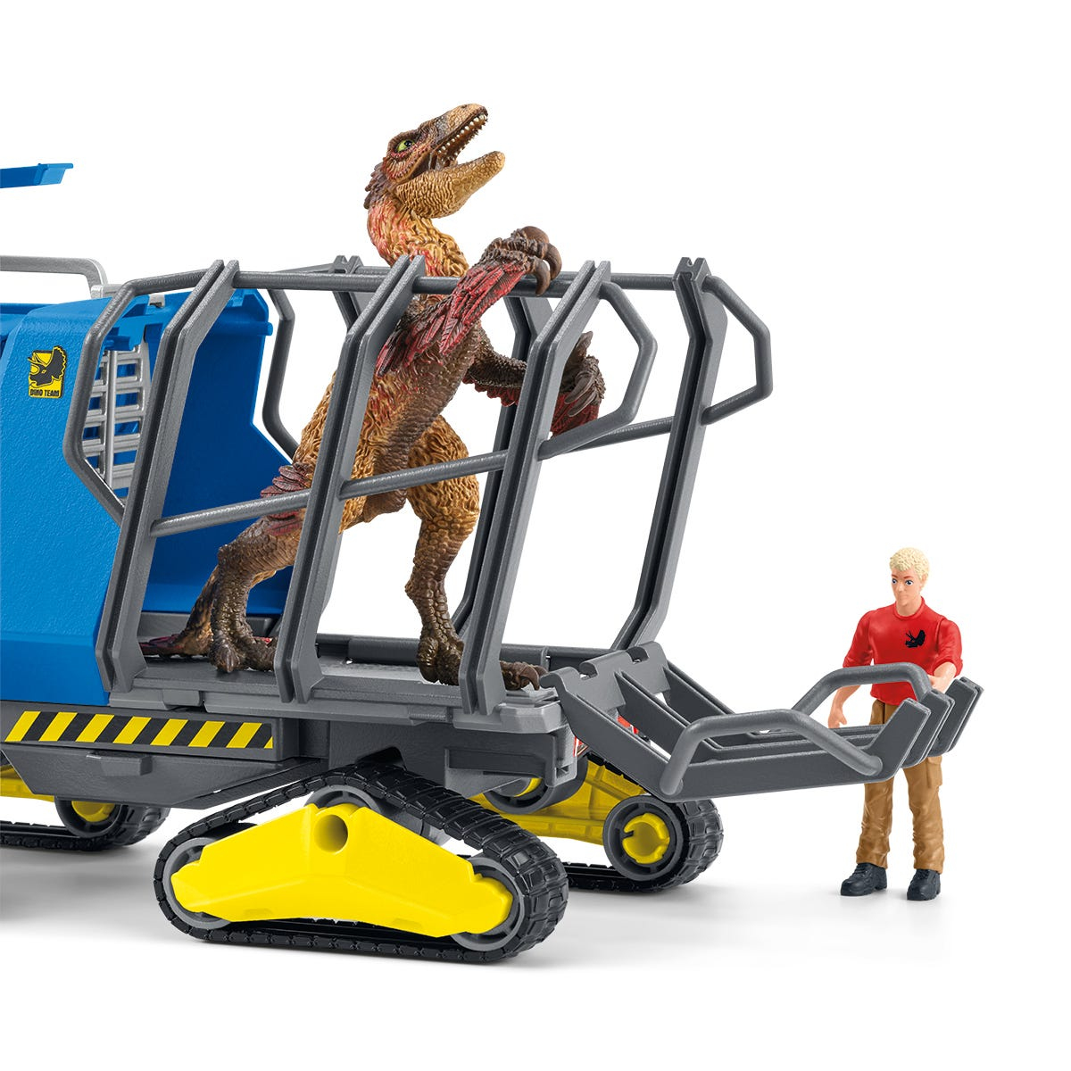 A toy set with dinosaur figures inside a blue and grey vehicle, with a human figure nearby.