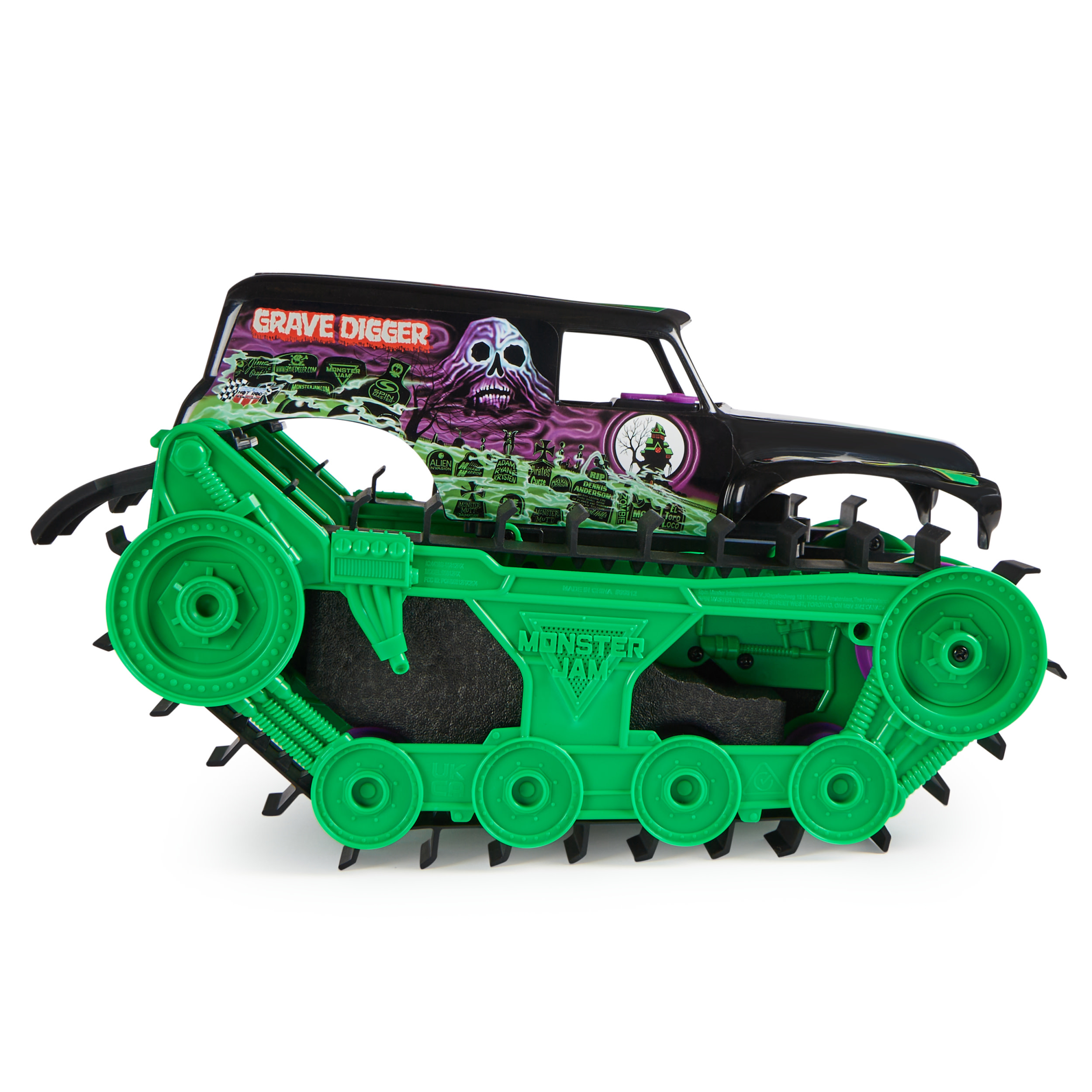 Zabawkowa ciężarówka Monster Jam Grave Digger z zielonymi gąsienicami. Ma czarną górę z motywem czaszki.