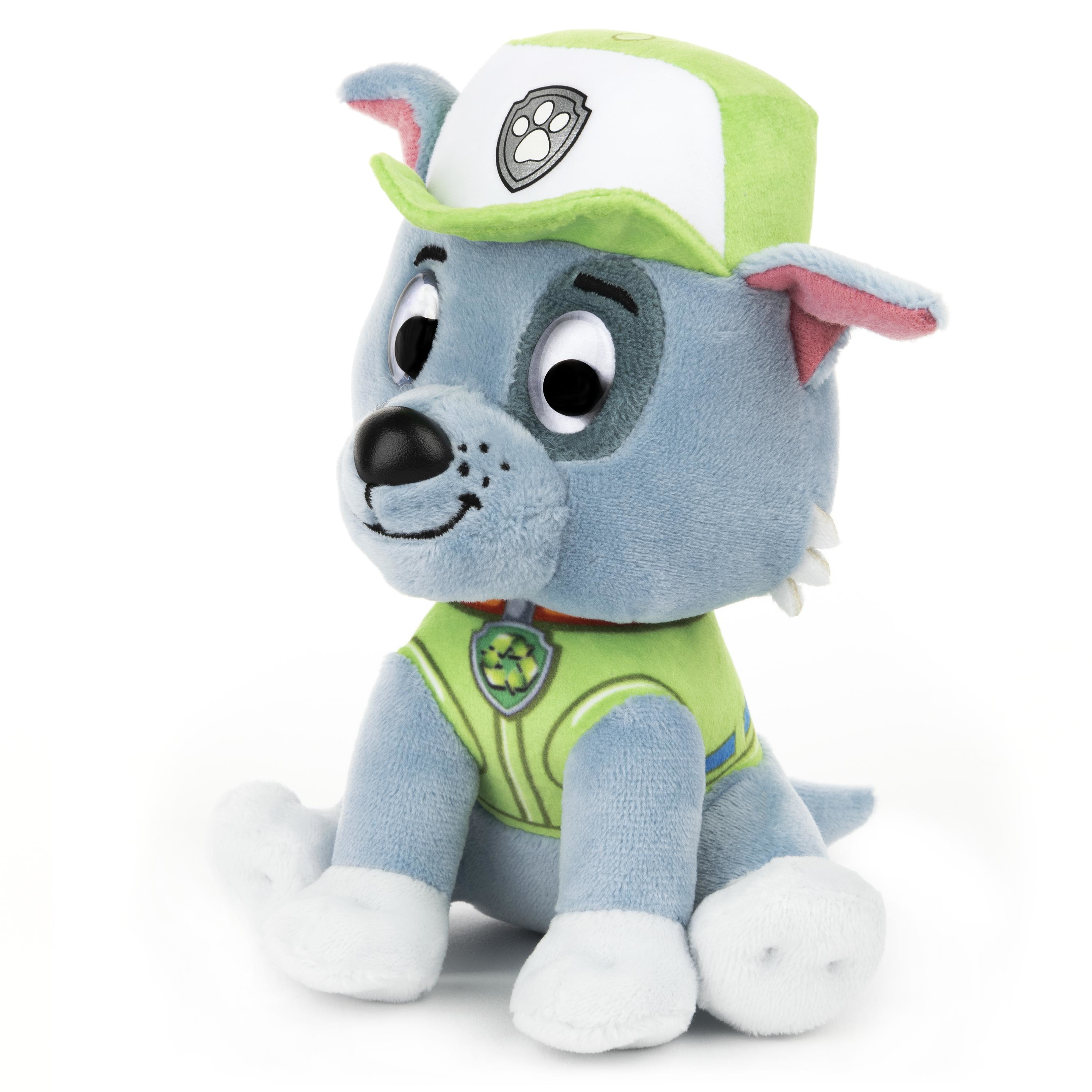 Ein Plüschtier einer Paw Patrol-Figur, ein grauer Hund mit grünem Hut und Weste, der sitzt.