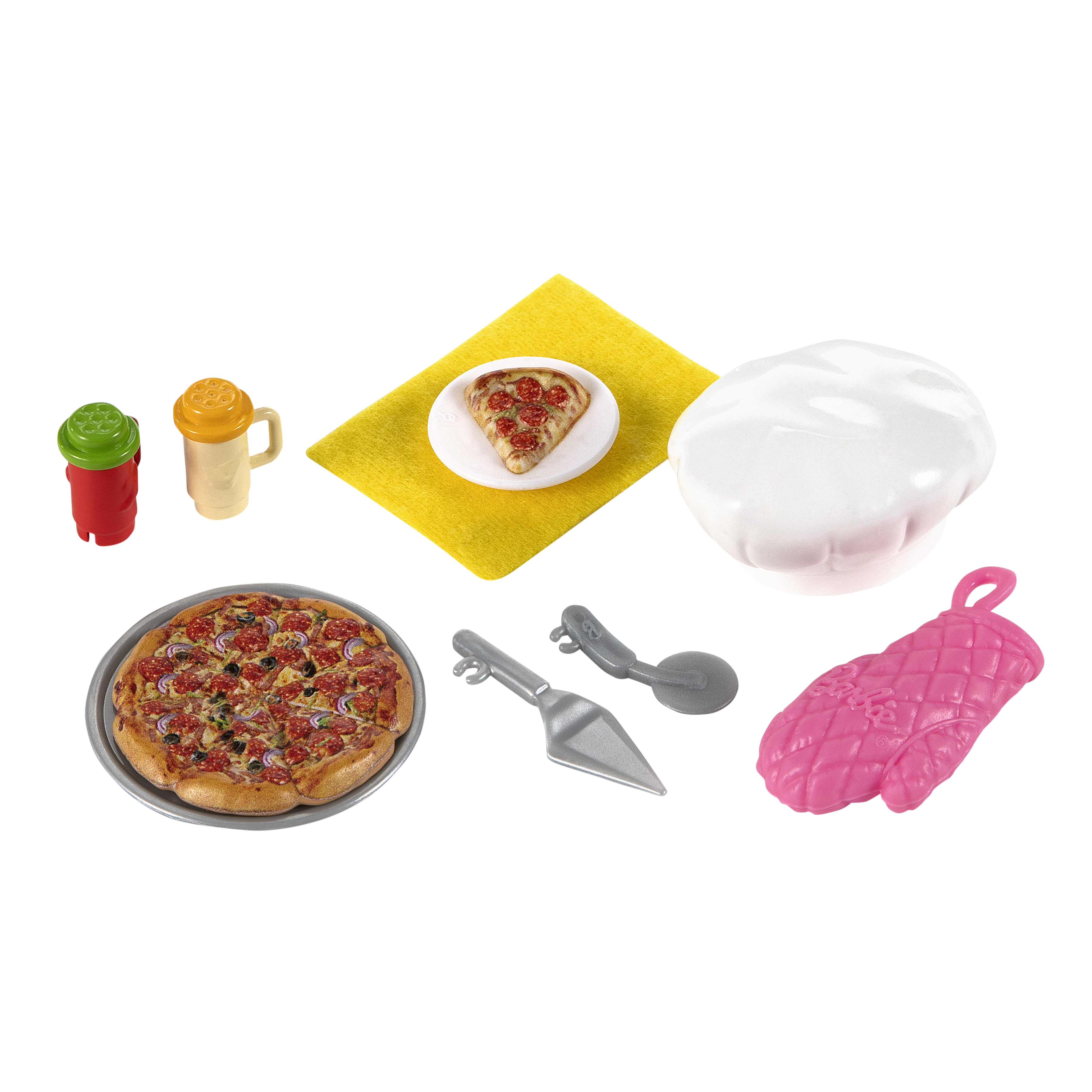 Zestaw do robienia pizzy: pizza, czapka kucharska, przybory i składniki.