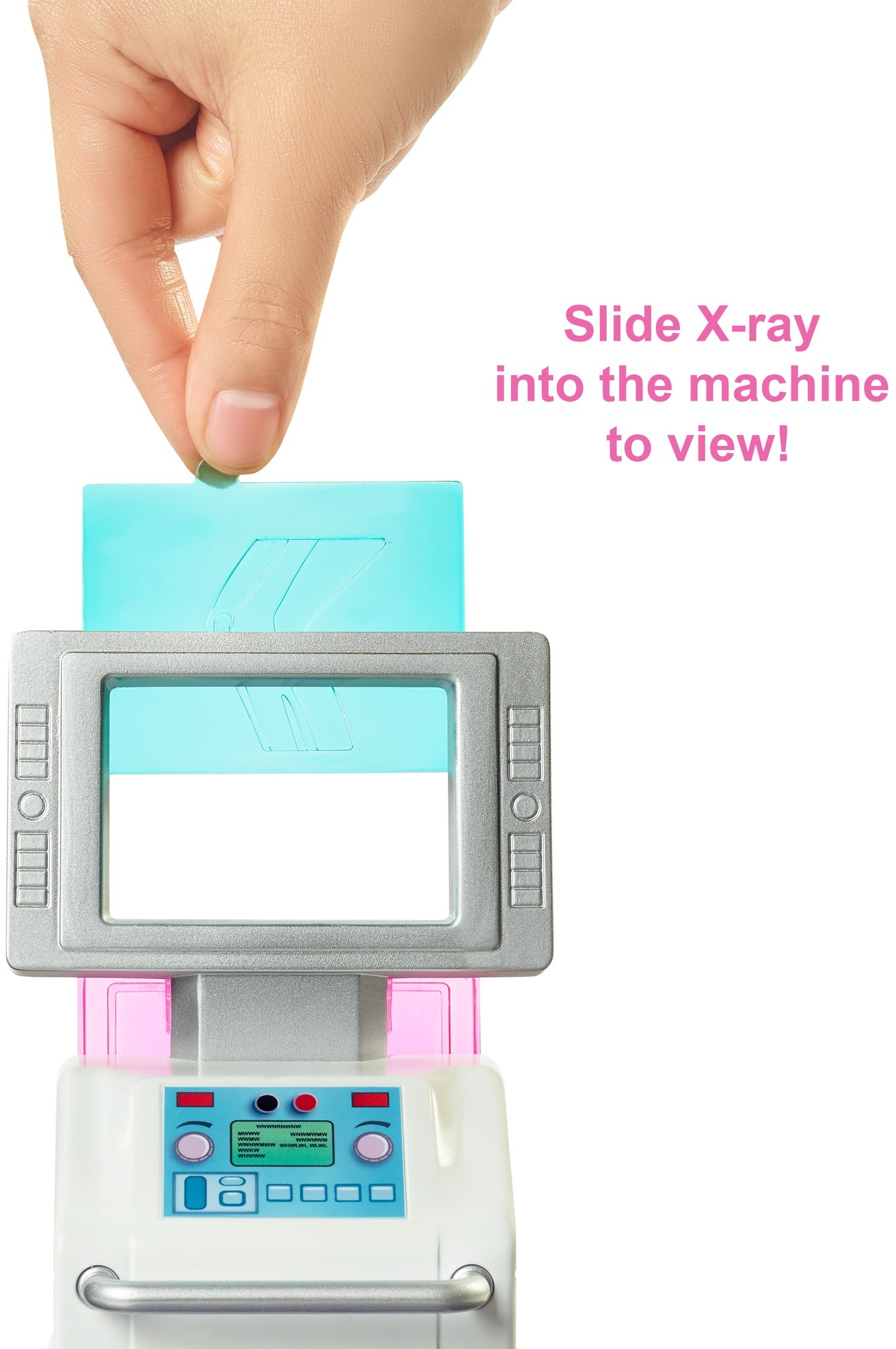 Ręka wkładająca zdjęcie rentgenowskie do zabawkowego aparatu medycznego. Tekst mówi: "Wsuń zdjęcie rentgenowskie do maszyny, aby zobaczyć!"