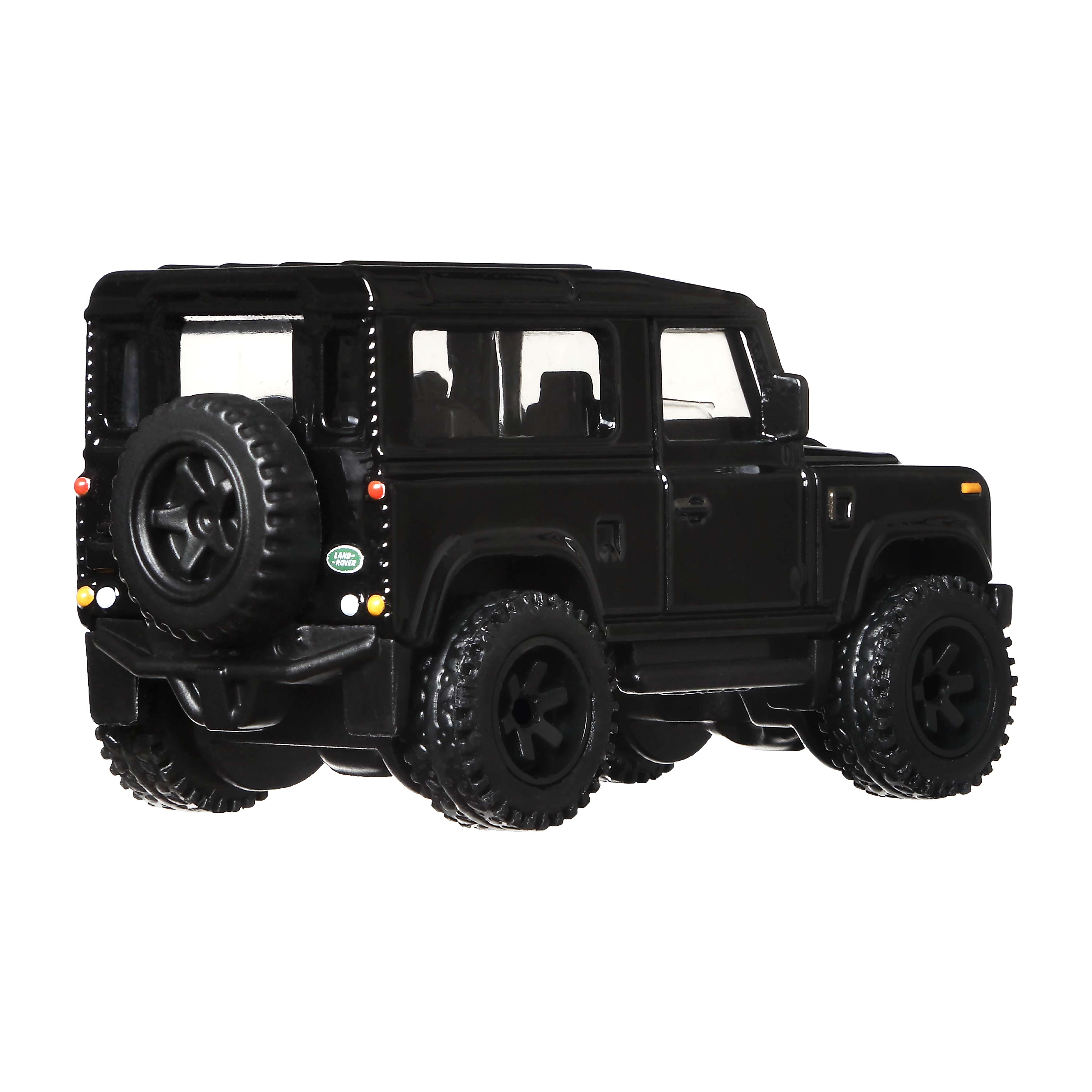 Czarny SUV Land Rover Defender jest pokazany od tyłu, z kołem zapasowym i czarnymi oponami.