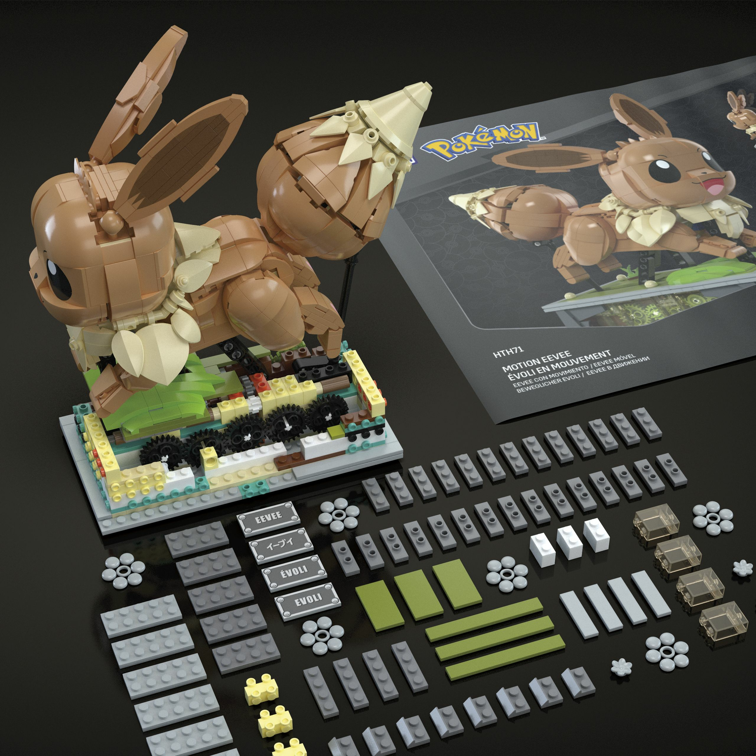 Una figura Lego di Eevee, pezzi e scatola su una superficie nera. La figura di Eevee è marrone.