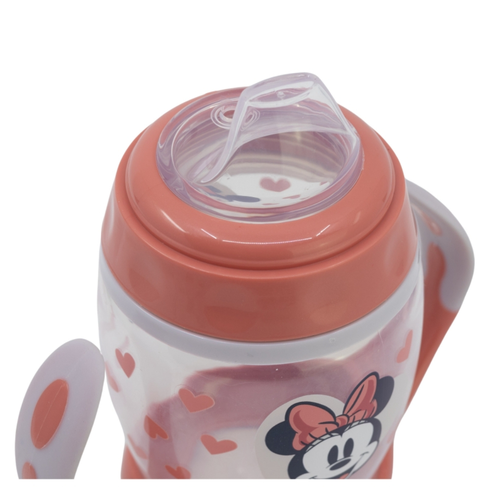 Un vaso para bebé con diseño de Minnie Mouse y tapa roja.