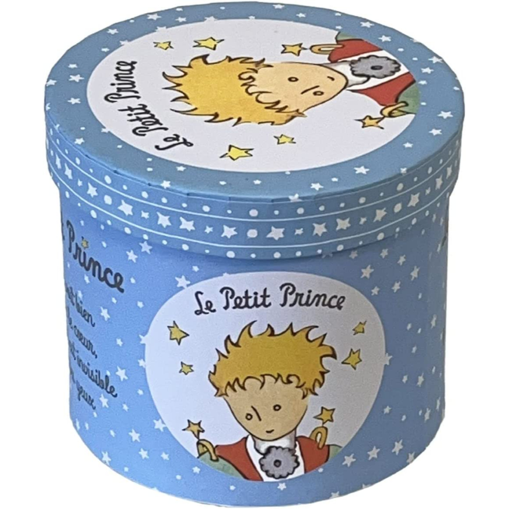 Una caja circular azul con un dibujo del Principito y estrellas. La caja tiene tapa.