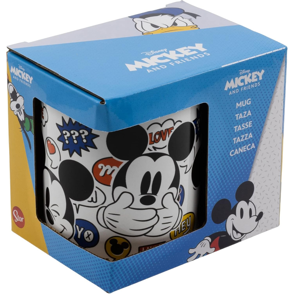 Taza de Mickey Mouse en una caja. La taza tiene a Mickey con bocadillos.