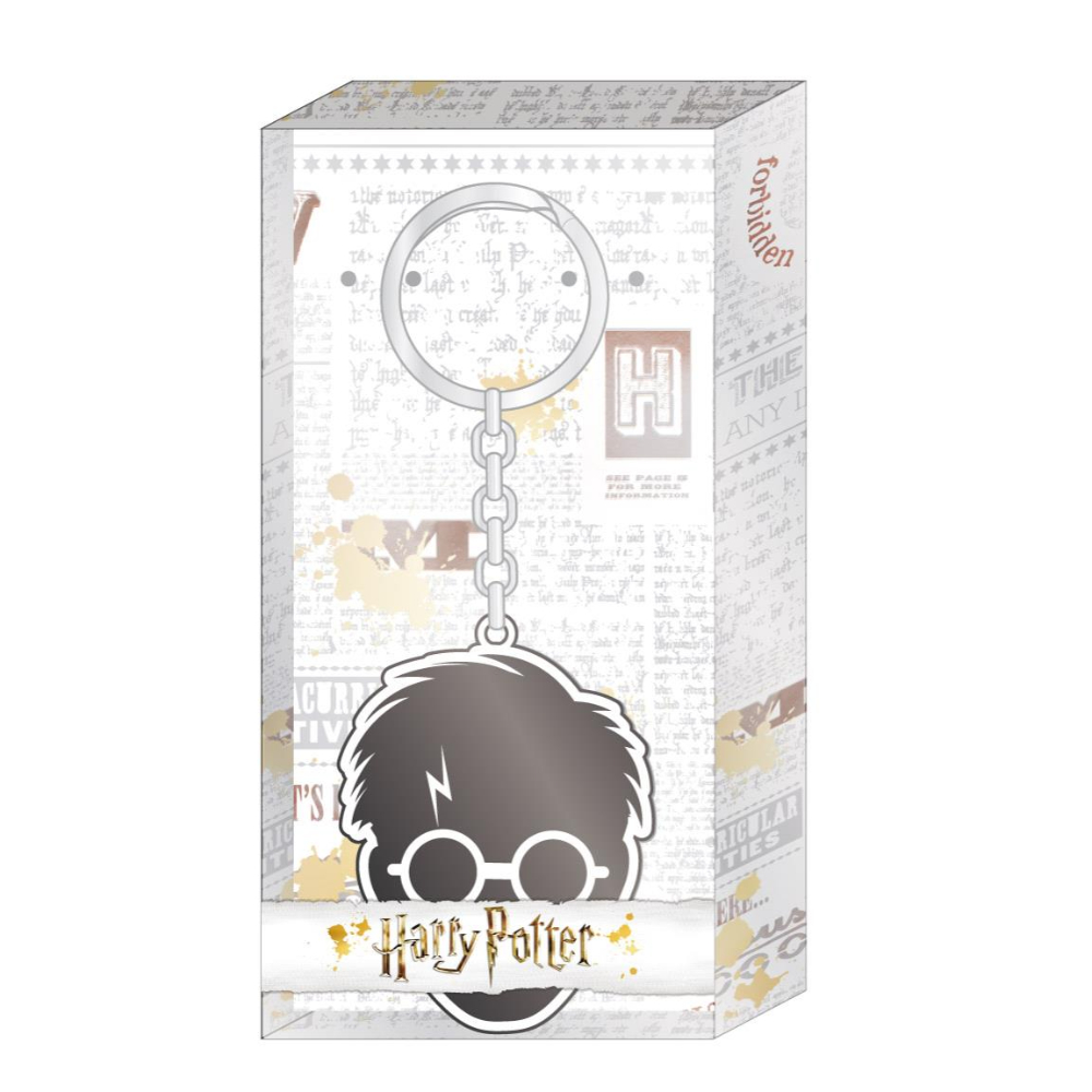 Llavero de Harry Potter en caja. El llavero representa la cabeza y las gafas de Harry.
