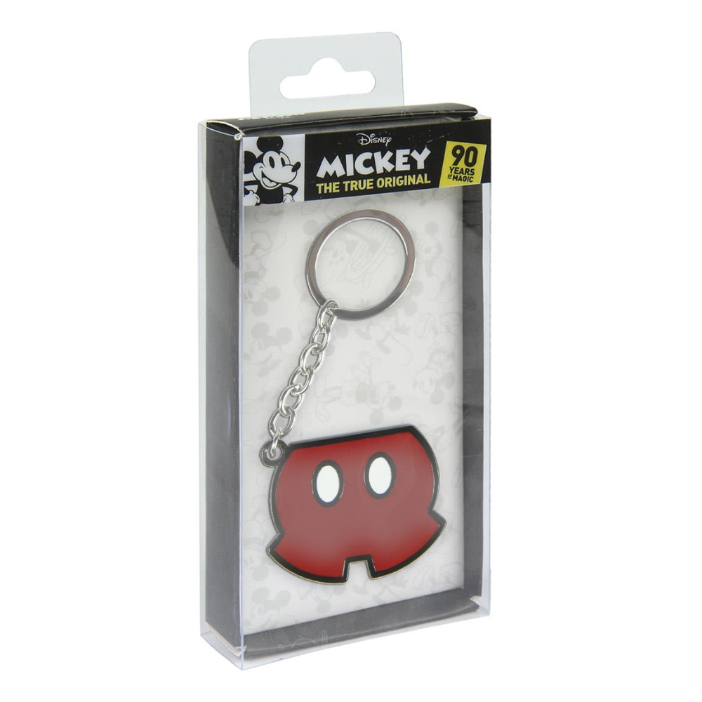 Llavero de Mickey Mouse en una caja. El llavero es rojo y blanco, en forma de los pantalones cortos de Mickey.