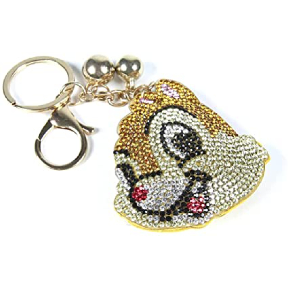 Un llavero de Chip y Dale con detalles dorados y detalles de joya, con un cierre dorado.