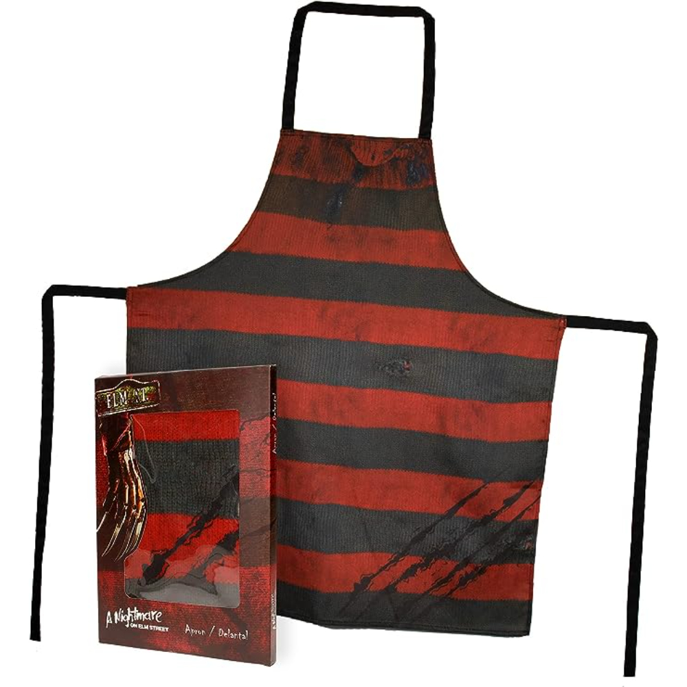 Delantal de Freddy Krueger, a rayas rojas y negras con salpicaduras de sangre. Caja con guante de Freddy.