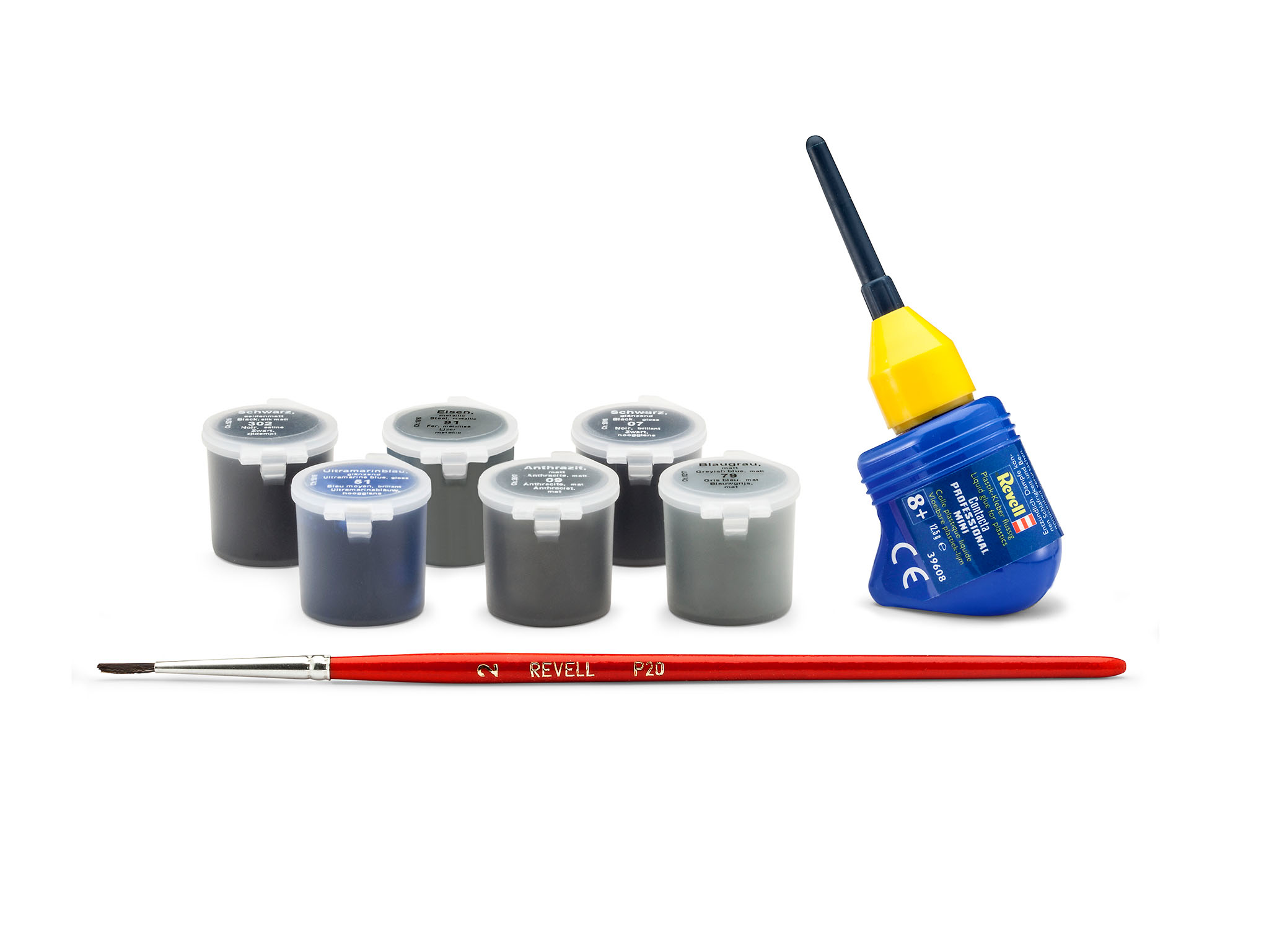 Un set di vernici per modellismo e un pennello accanto a un tubetto di colla.