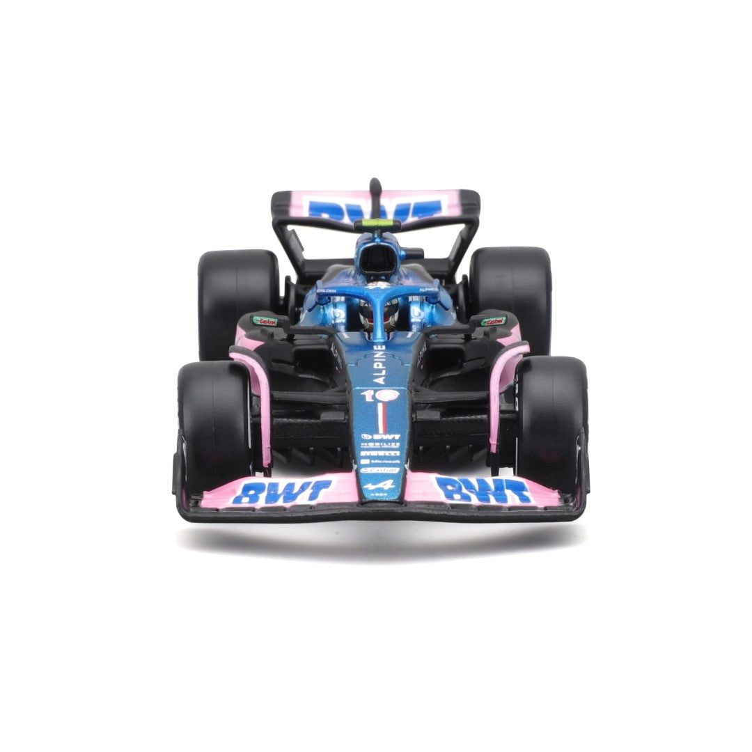 Ein blau-rosa Formel-1-Rennwagen, von vorne gesehen, auf weißem Hintergrund.