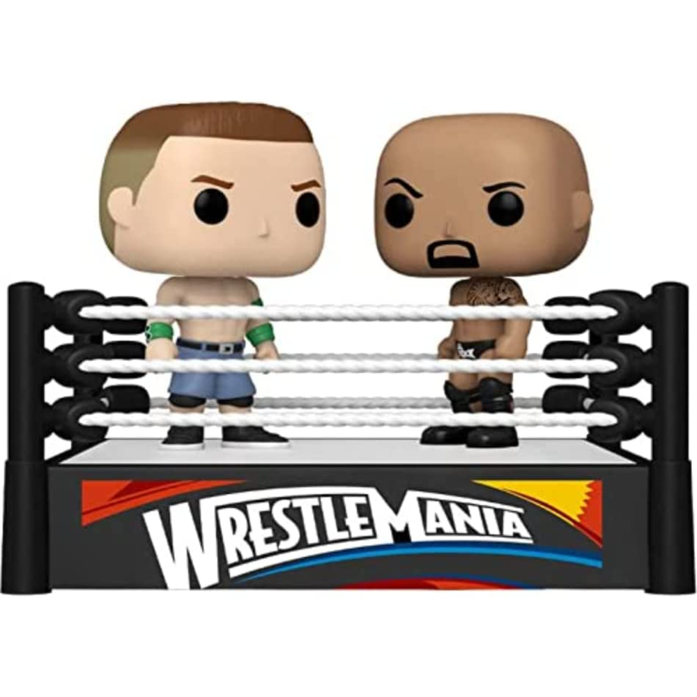 Dwie figurki wrestlingu na ringu, z napisem Wrestlemania z przodu.