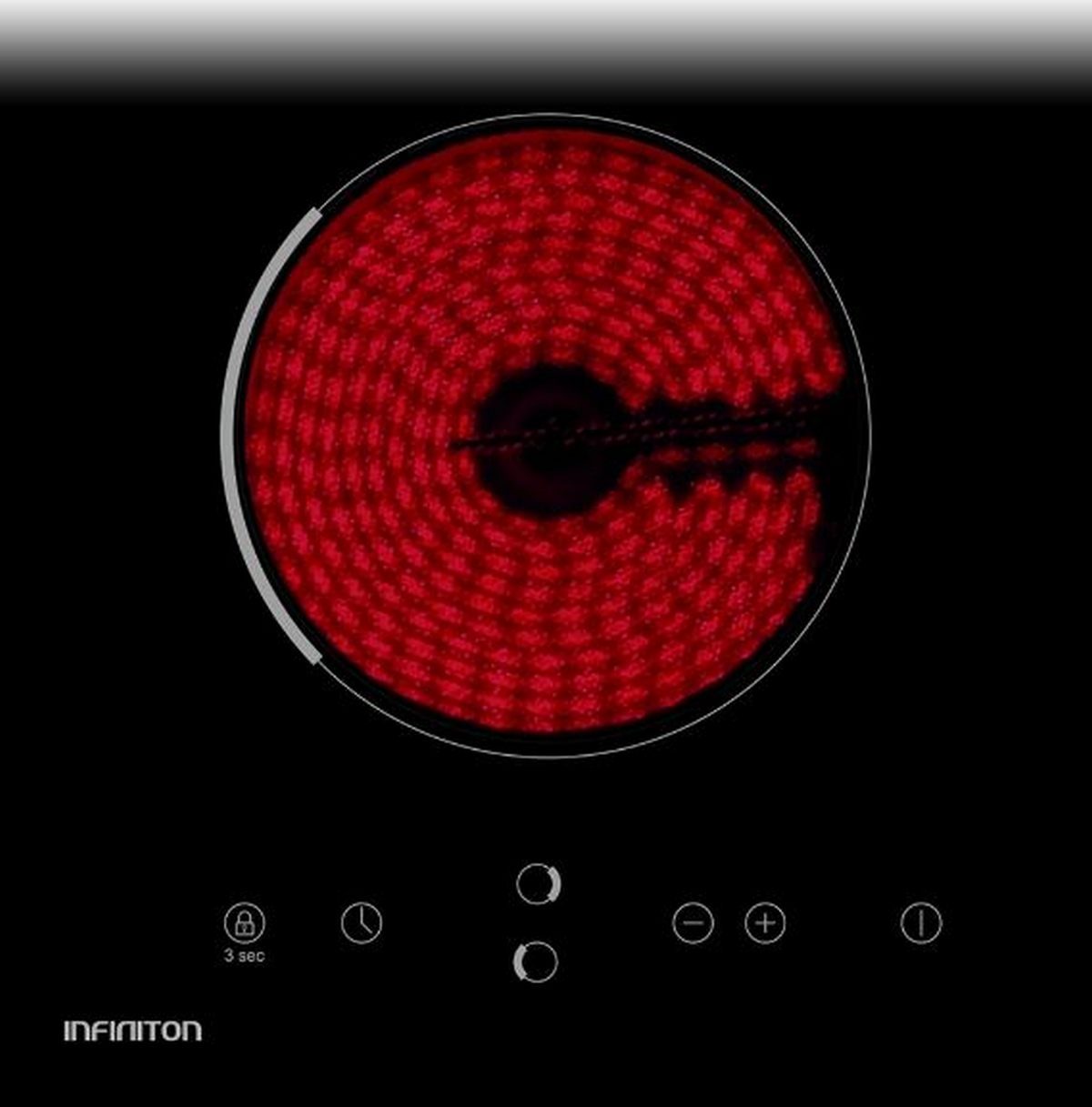 Una placa de inducción negra con un elemento calefactor rojo en un patrón circular.