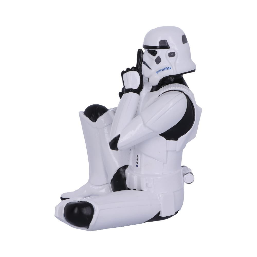 Stormtrooper beeldje knielend, met vinger op lippen, op een witte basis. Het is een 'shhh' pose.