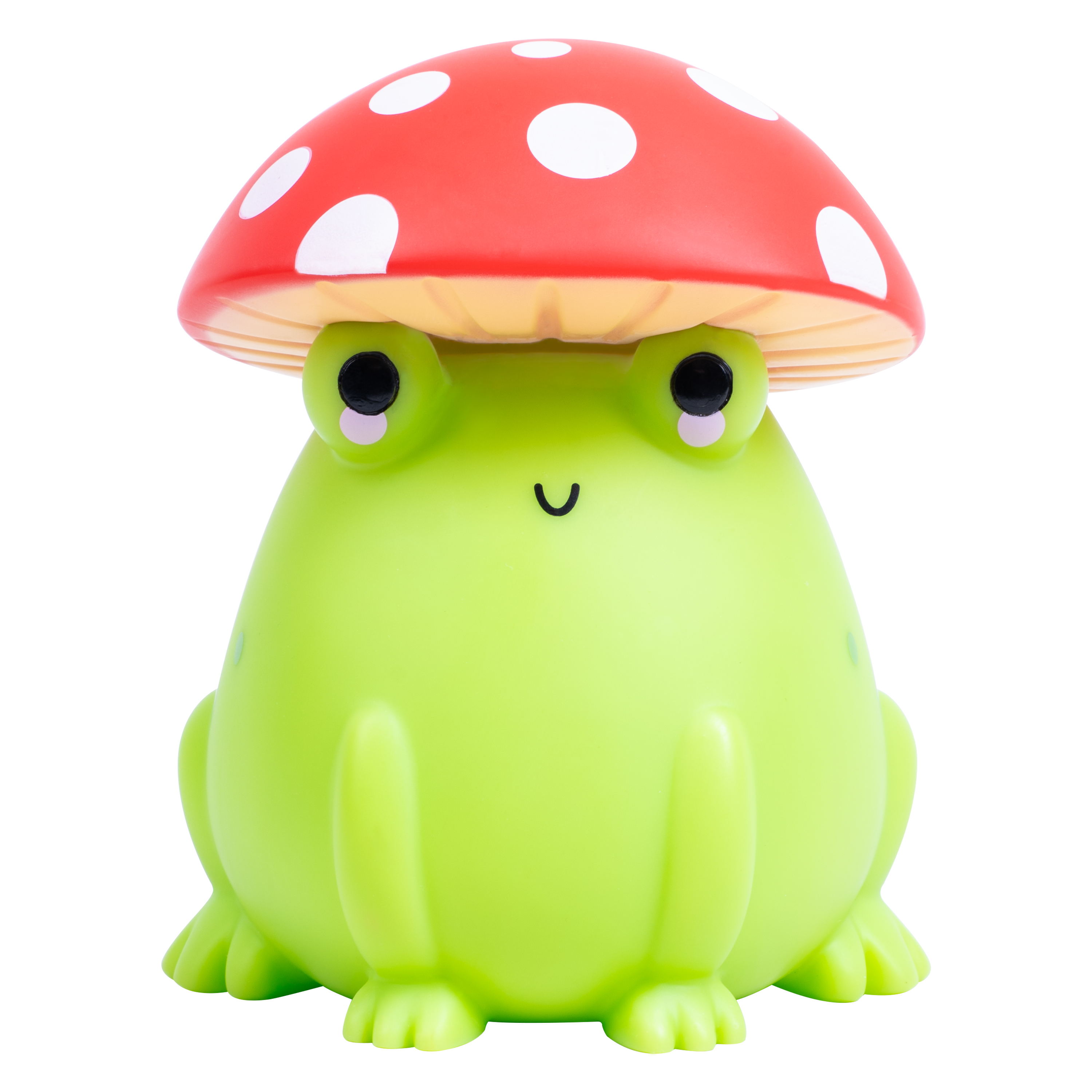 Een groene kikkerlamp met een rode paddenstoelhoed met witte stippen. Witte achtergrond.