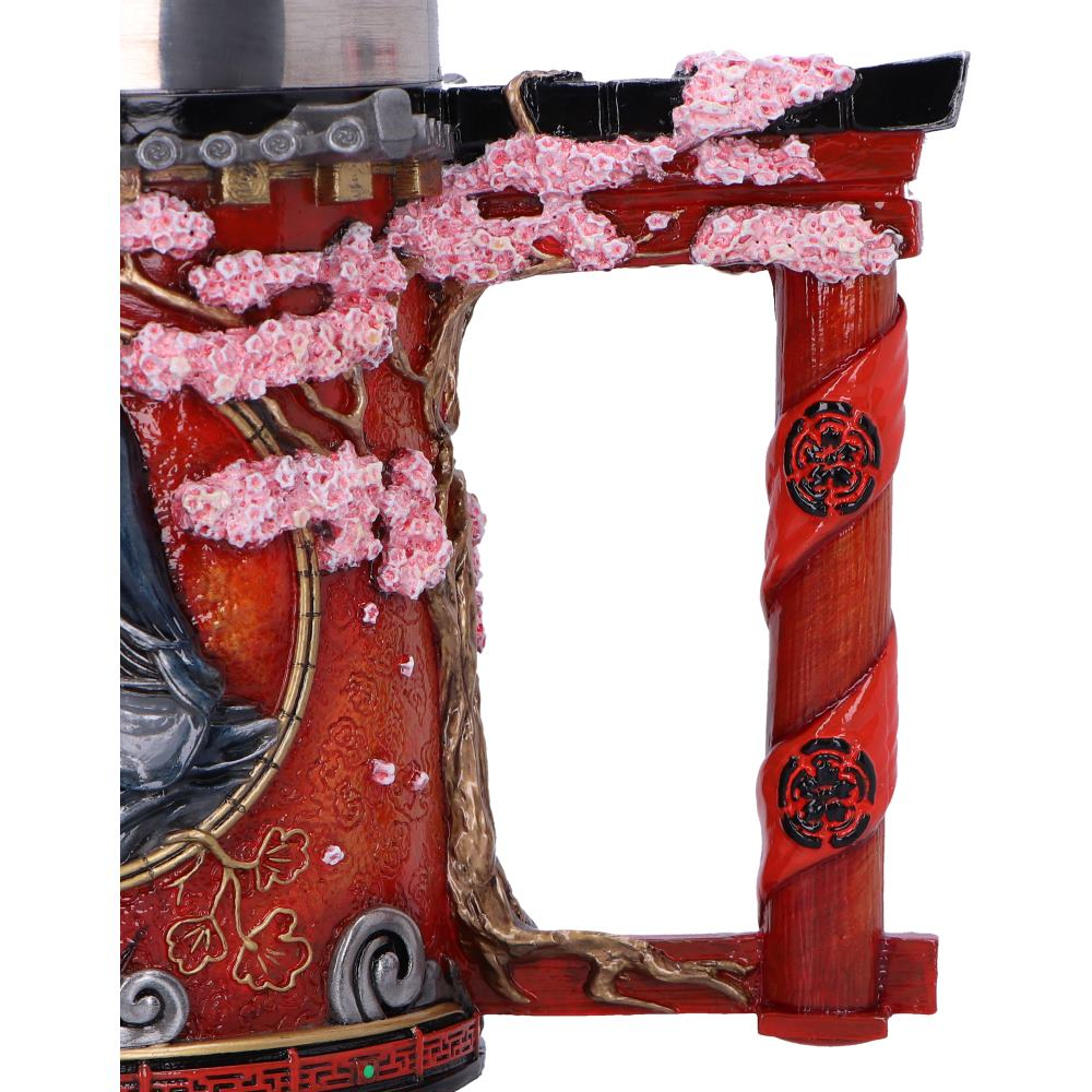 Red mug with a Japanese gate design, pink cherry blossoms, and a tree-shaped handle with red ribbons.