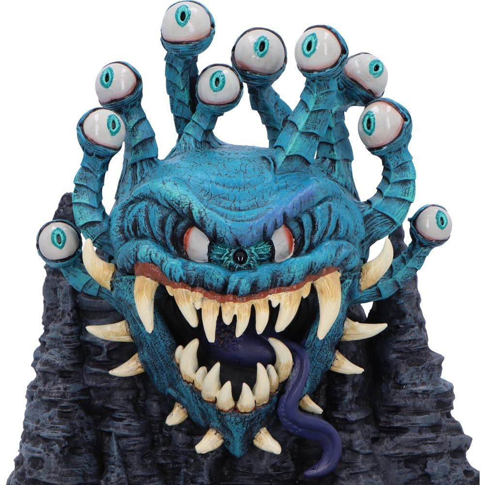 Een Beholder-figuur. Blauw, met meerdere ogen, tanden en een tong. Gemonteerd op een rotsachtige, donkere basis.