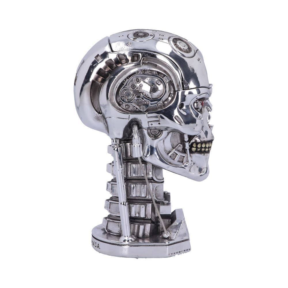 Terminator skull figurine, metallic silver, with mechanical details and a red eye.