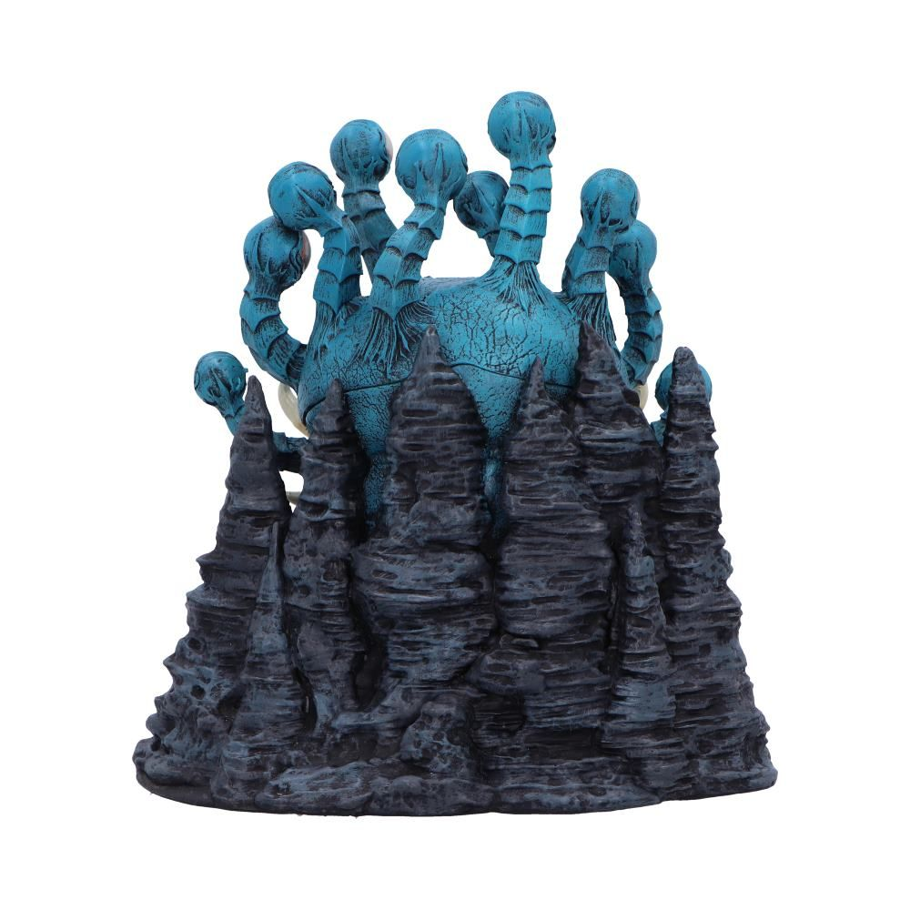 Een blauw wezen met meerdere tentakels op een rotsachtige structuur. Het wezen heeft een centrale bol.