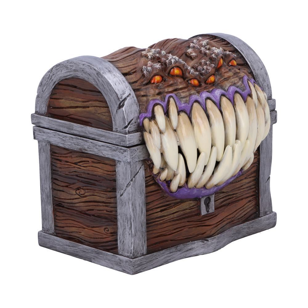 Houten schatkist met een monstermond en veel ogen bovenop. De kist is gesloten.