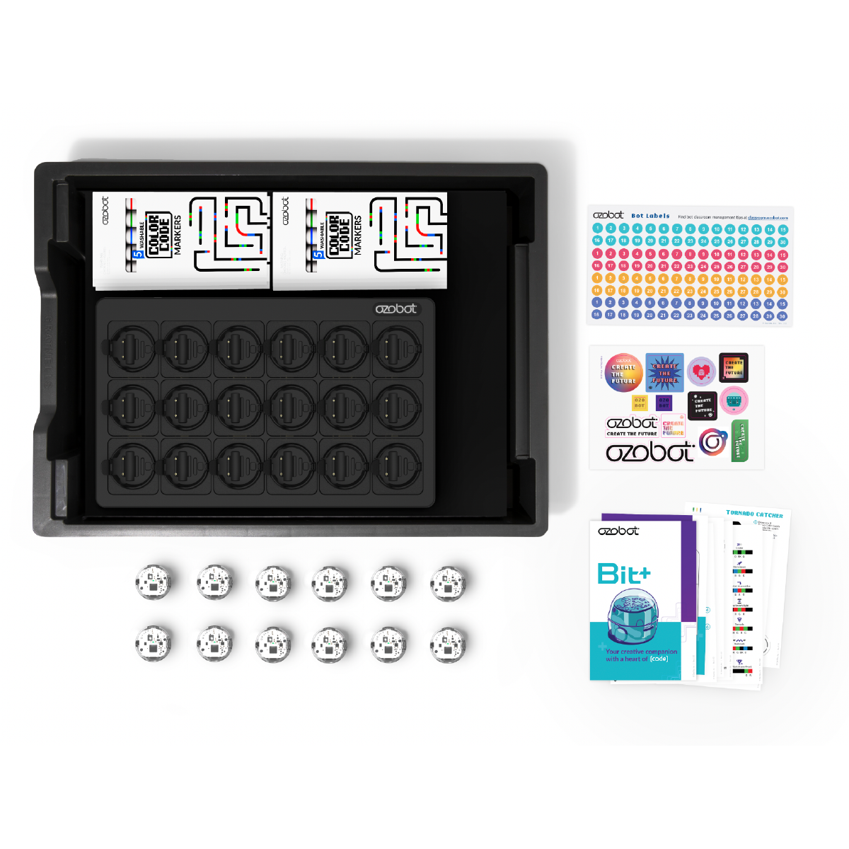 A black tray with markers, stickers, and small robots. The background is white.