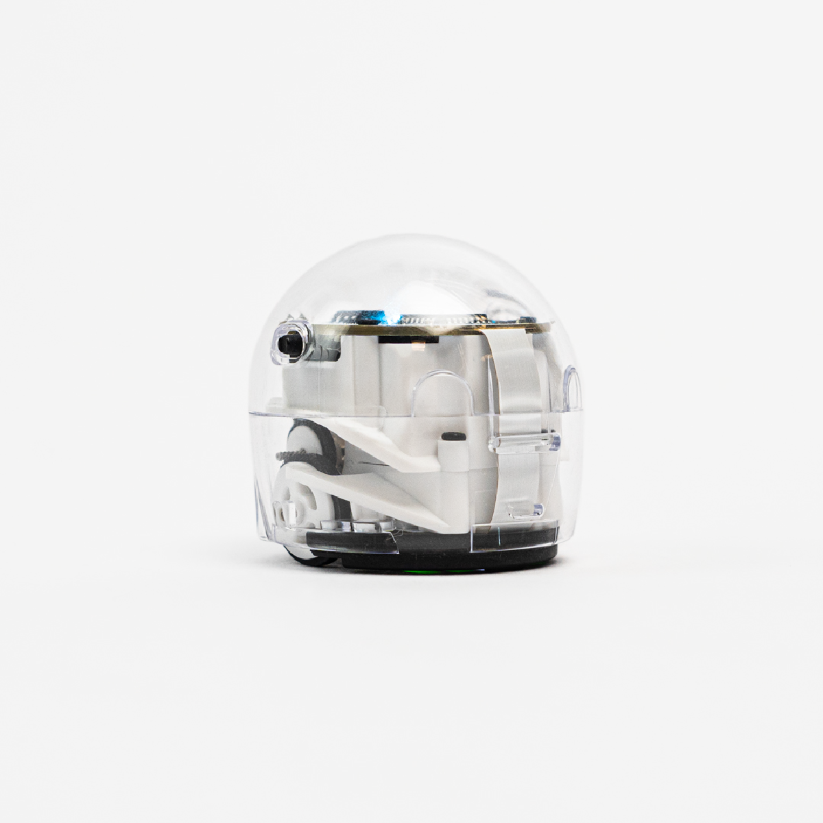 A clear plastic robot toy with white and black internal components, on a white background.