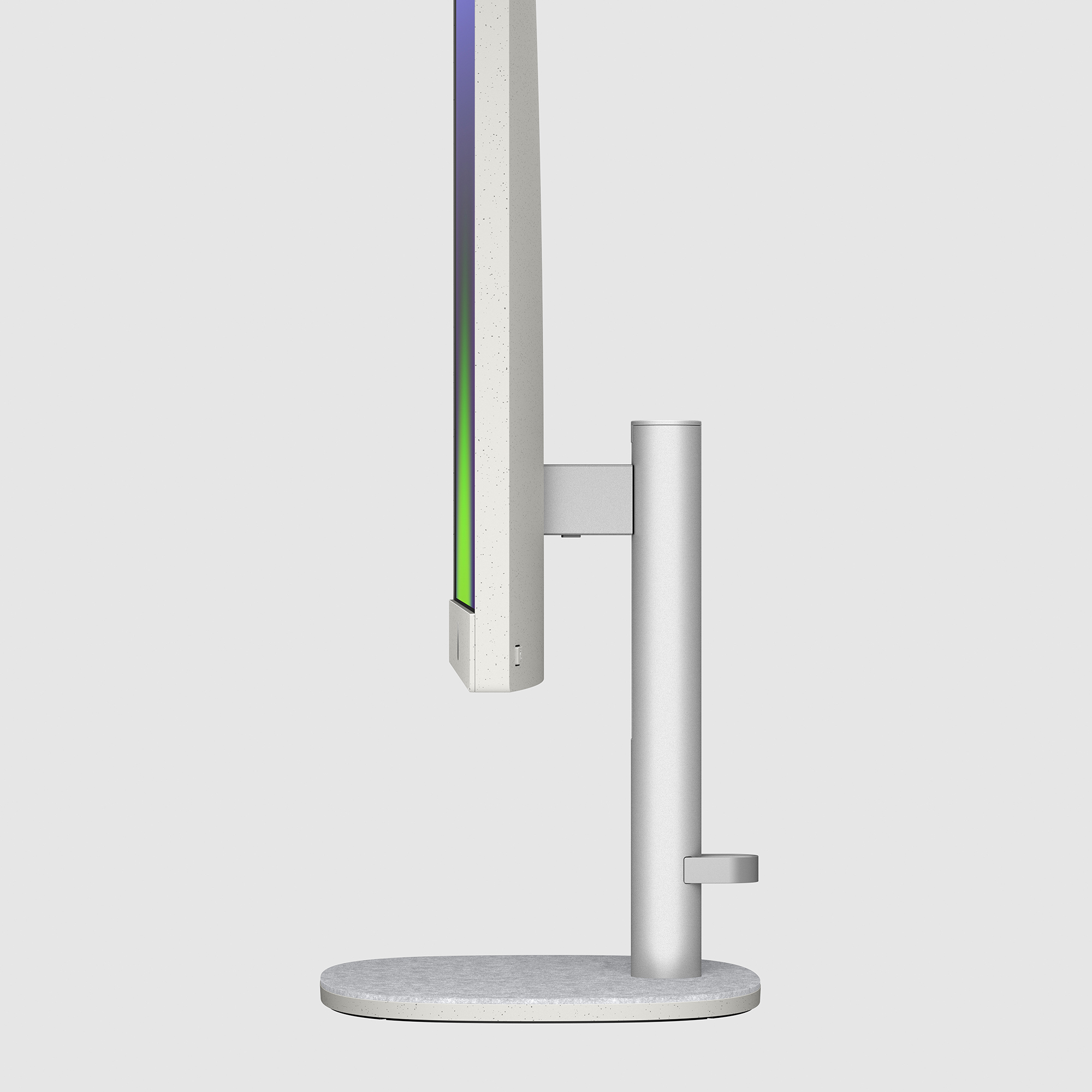 Widok z boku srebrnego monitora z kolorowym ekranem. Stojak jest srebrny.