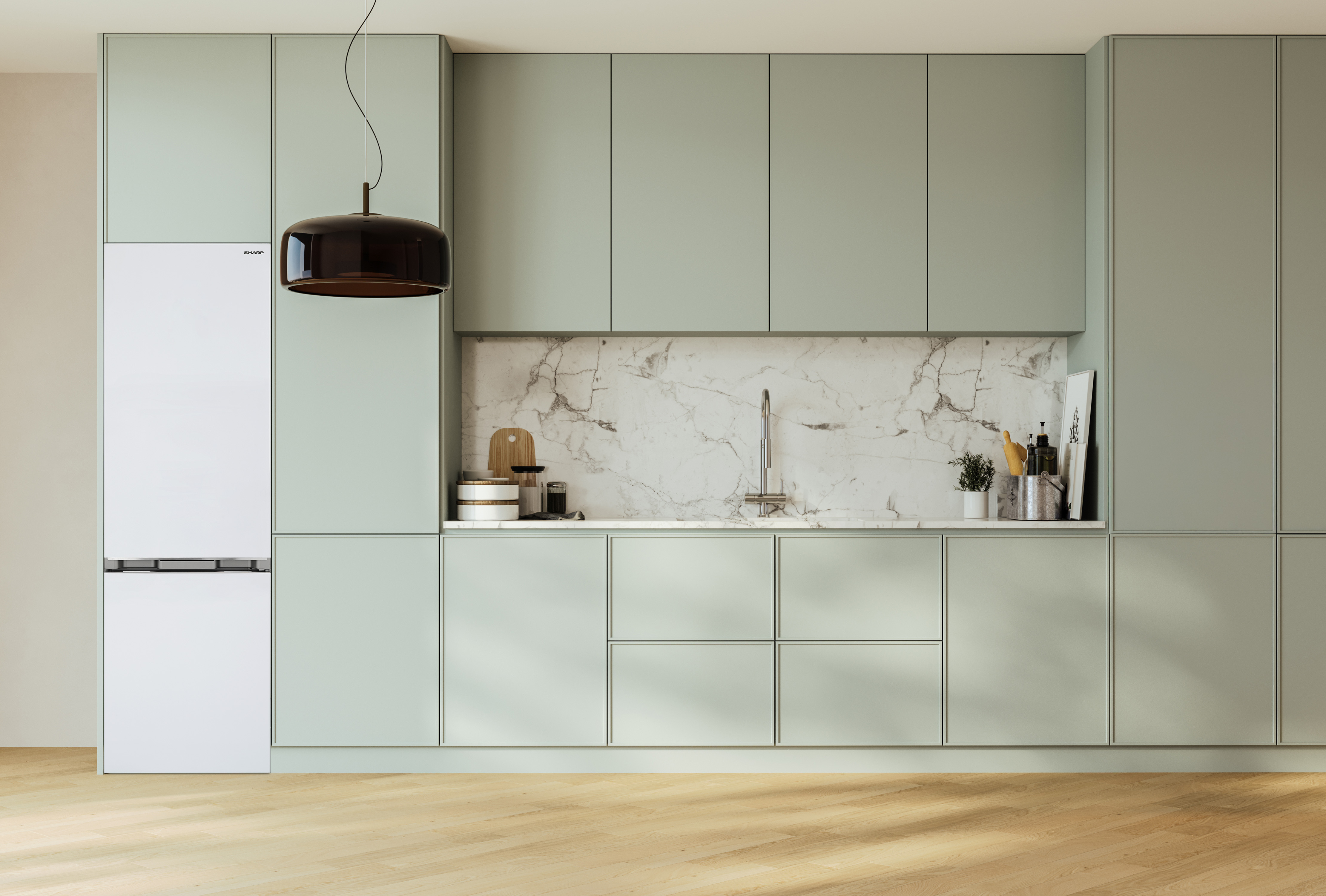Modern kitchen with light green cabinets and a white refrigerator.