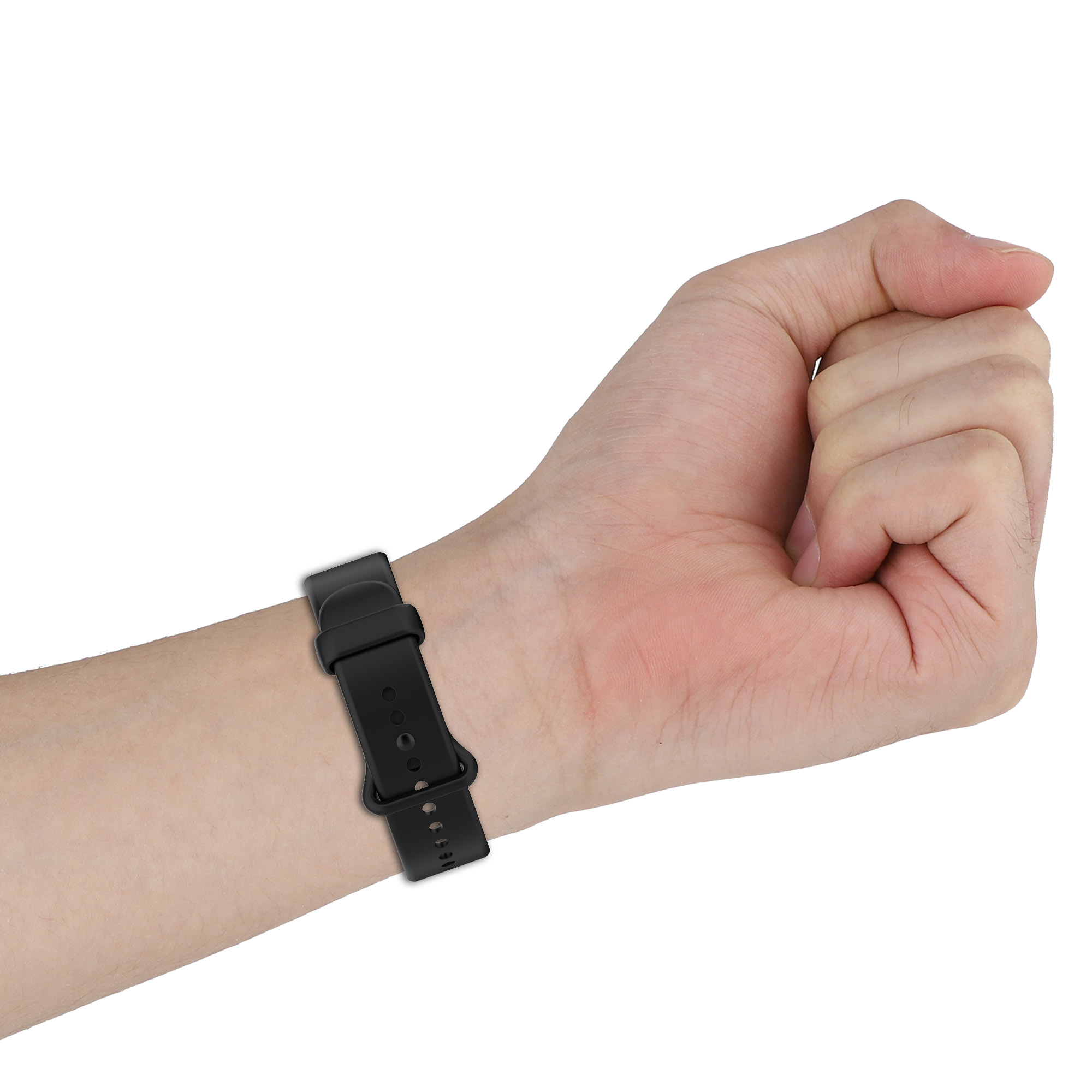 Ein schwarzes Armband mit Schnalle am Handgelenk einer Person, das Ende des Bandes zeigend.