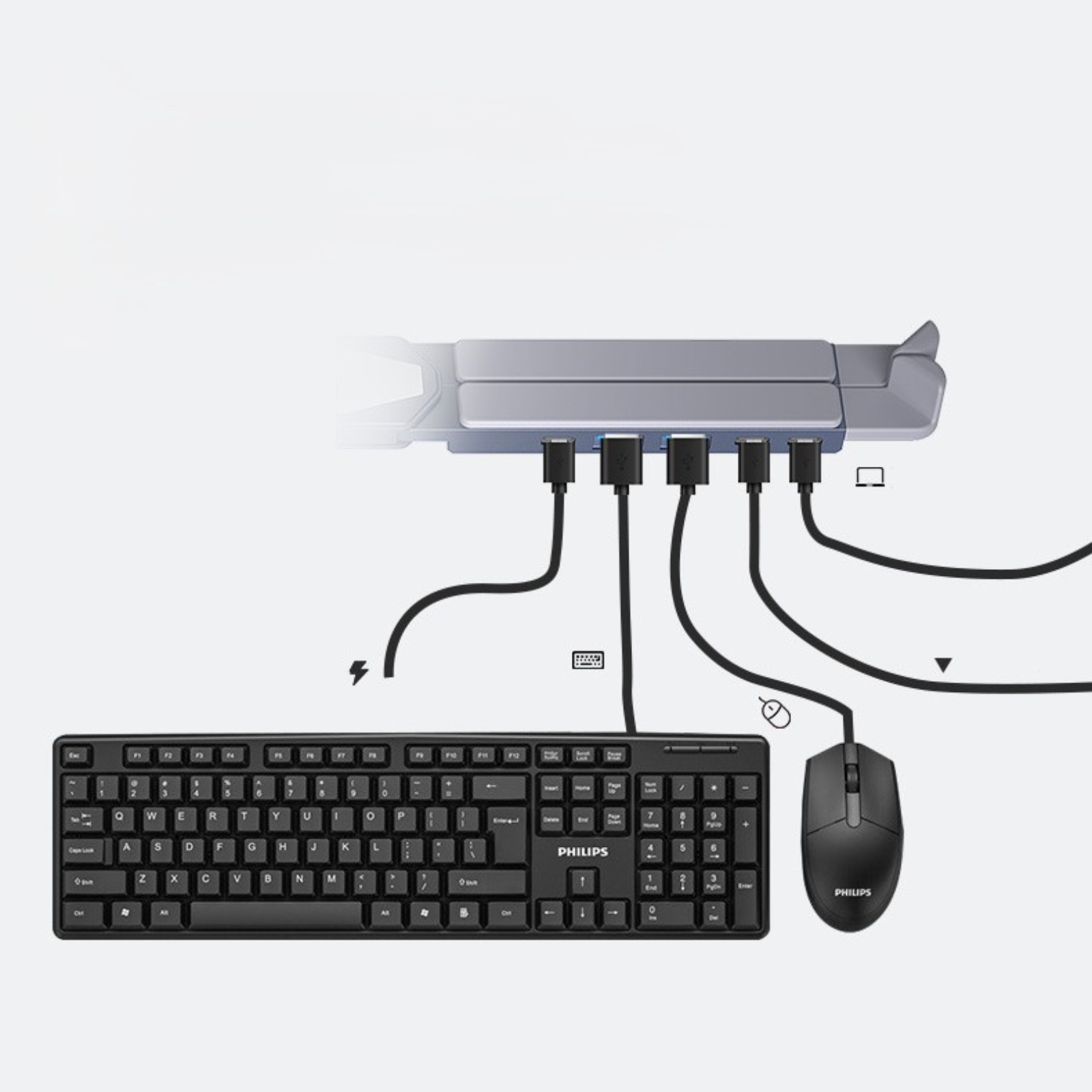 Eine Tastatur, Maus und USB-Hub, die mit einem Monitorständer verbunden sind.