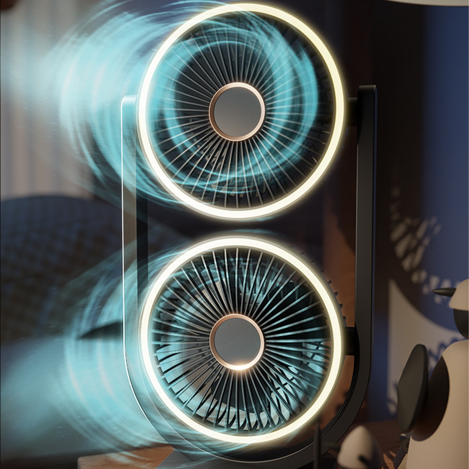 Ein schwarzer Ventilator mit zwei rotierenden, kreisförmigen Blättern und einem Lichtring.