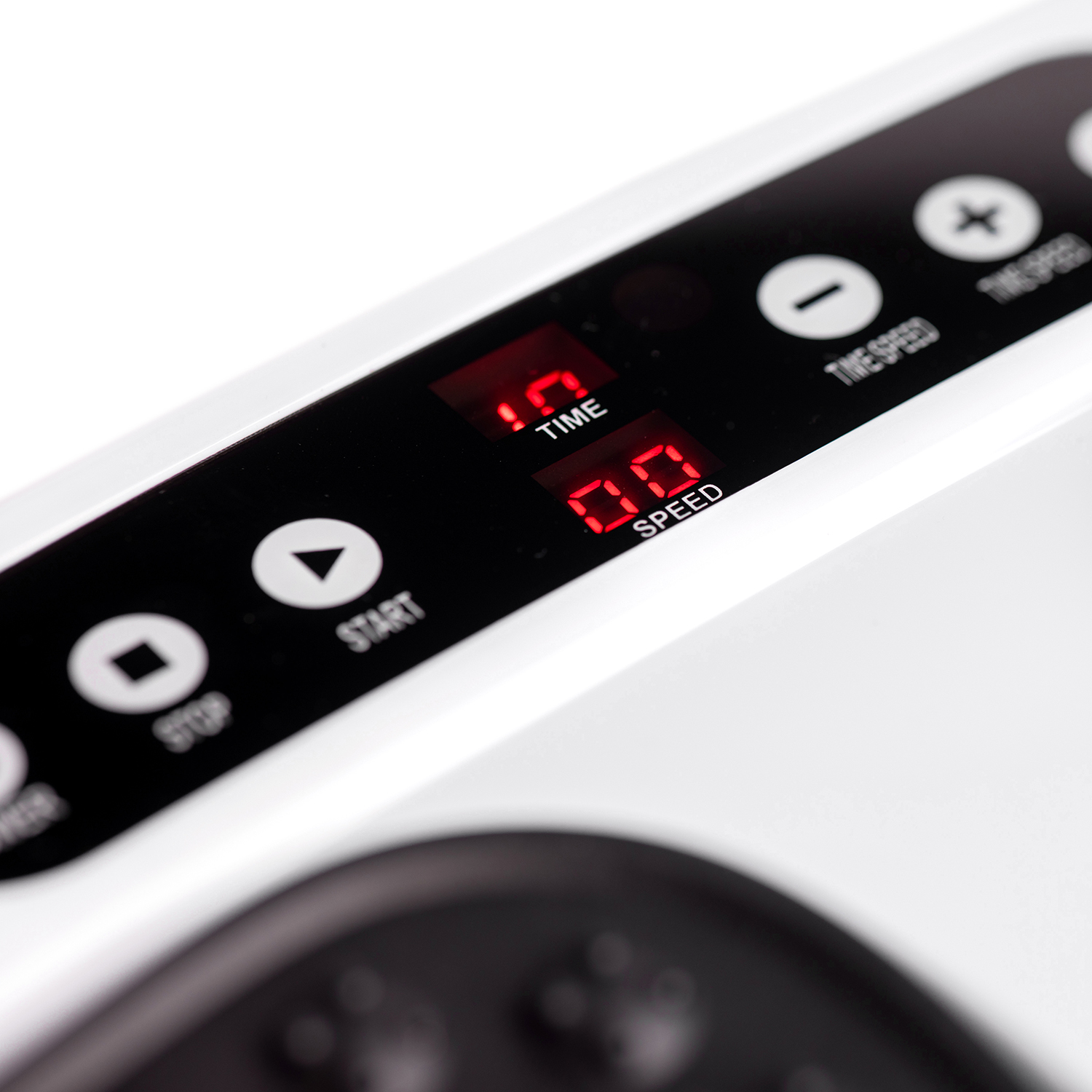 Close-up of a digital display showing time and speed with buttons for control.