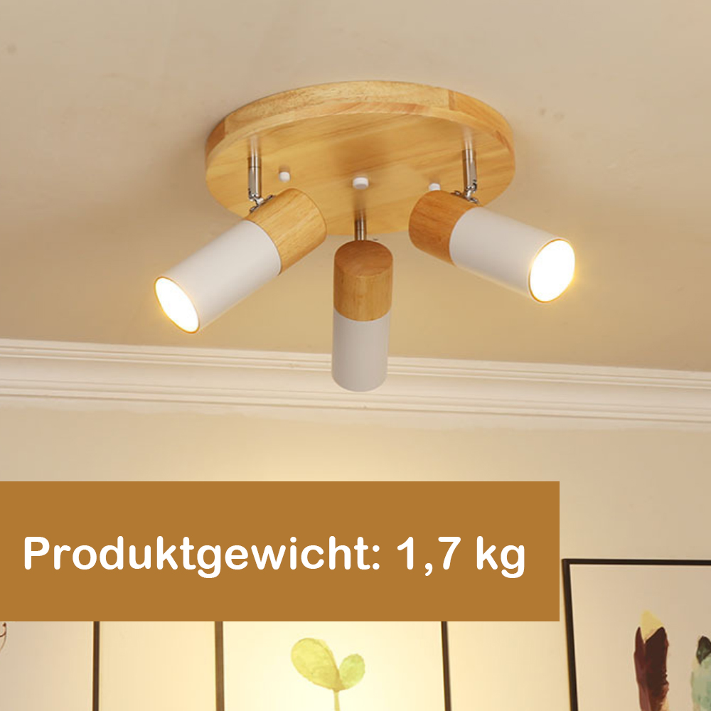 Deckenleuchte mit drei Strahlern, Holzsockel. Text: Produktgewicht: 1,7 kg.