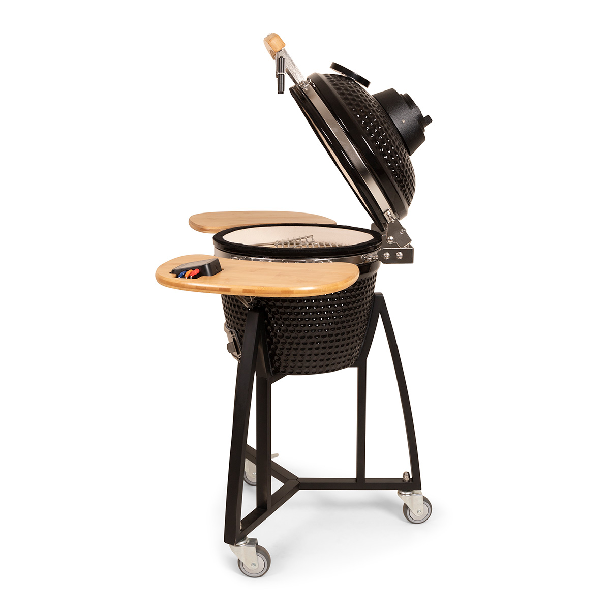 Black grill with lid open and wooden side tables, on wheels, white background.