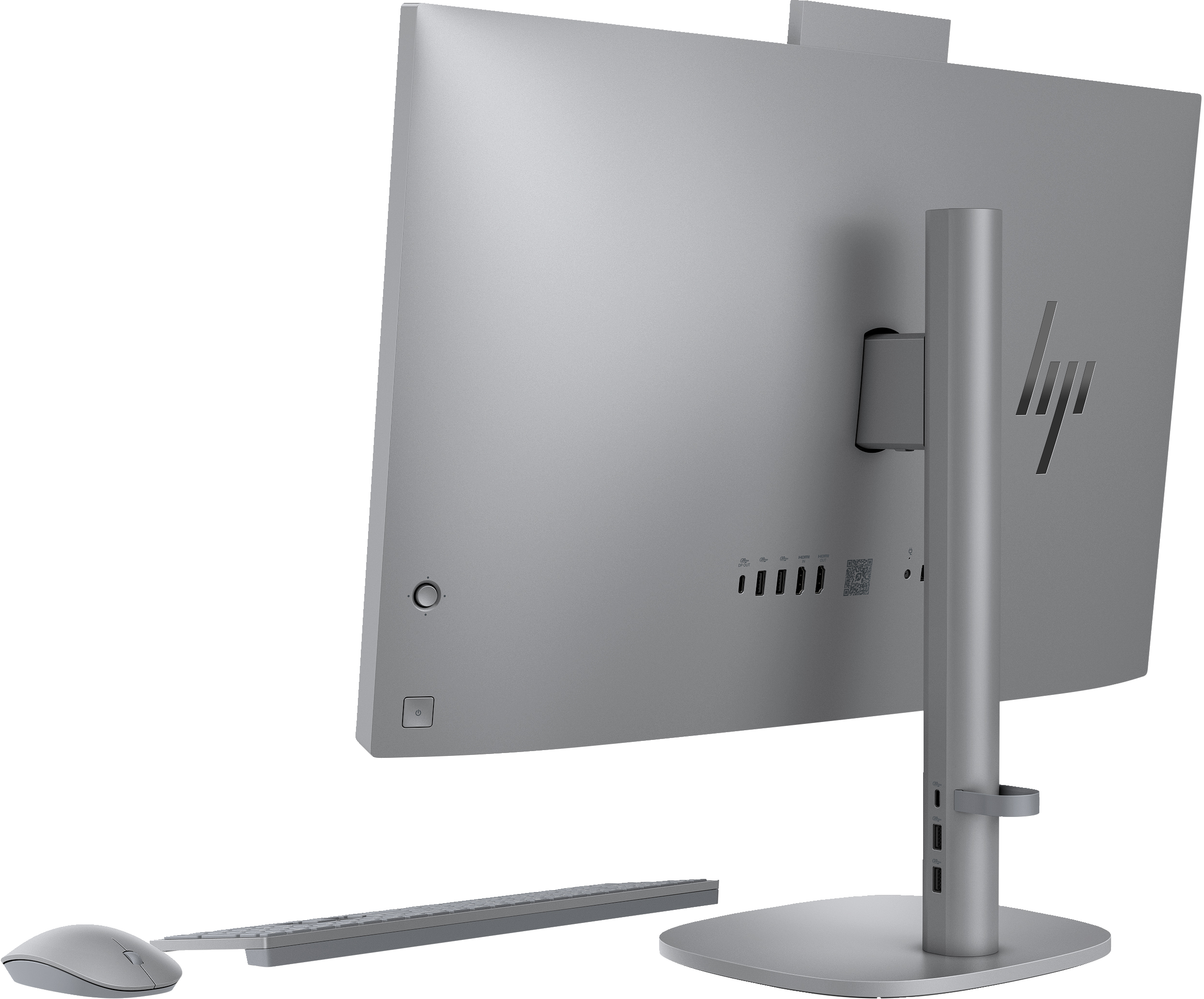 Silver all-in-one computer from the back, with keyboard and mouse.