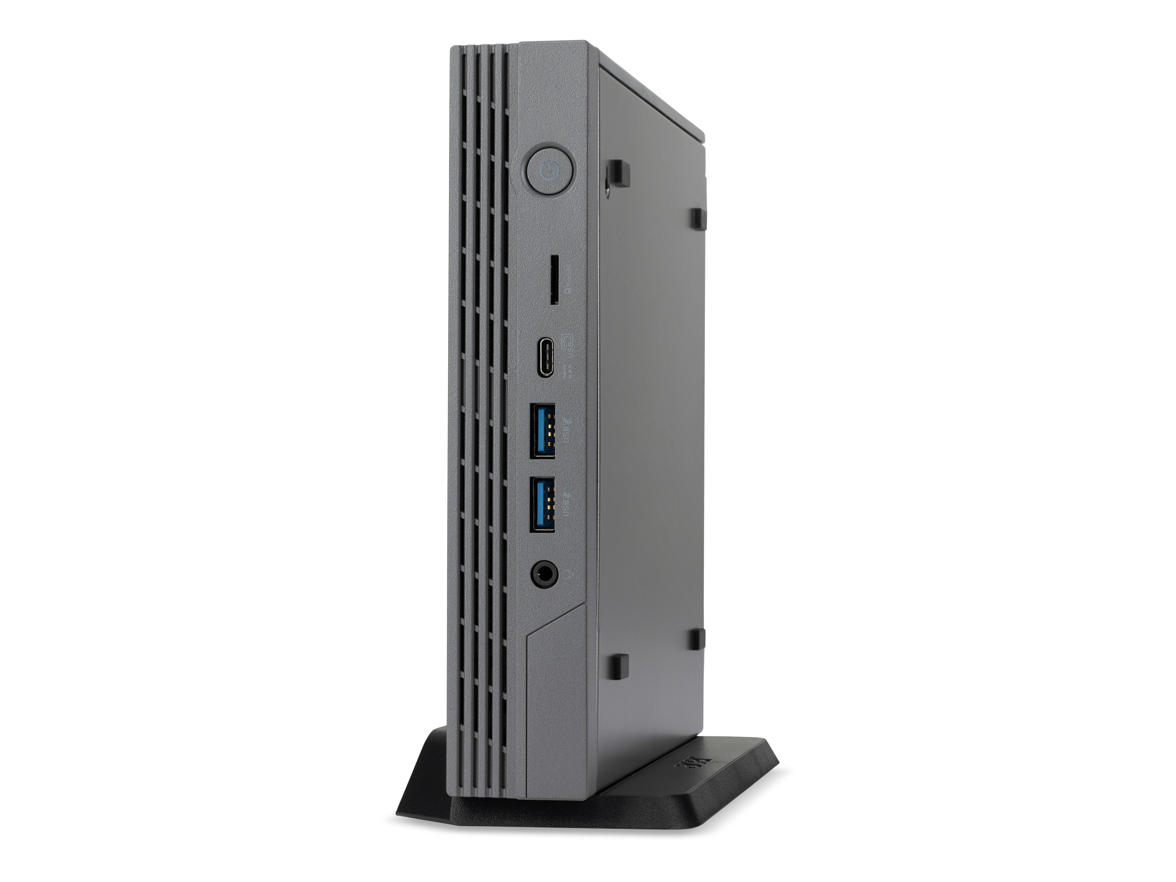 Un piccolo computer grigio con porte laterali, in piedi su un supporto nero, sfondo bianco.