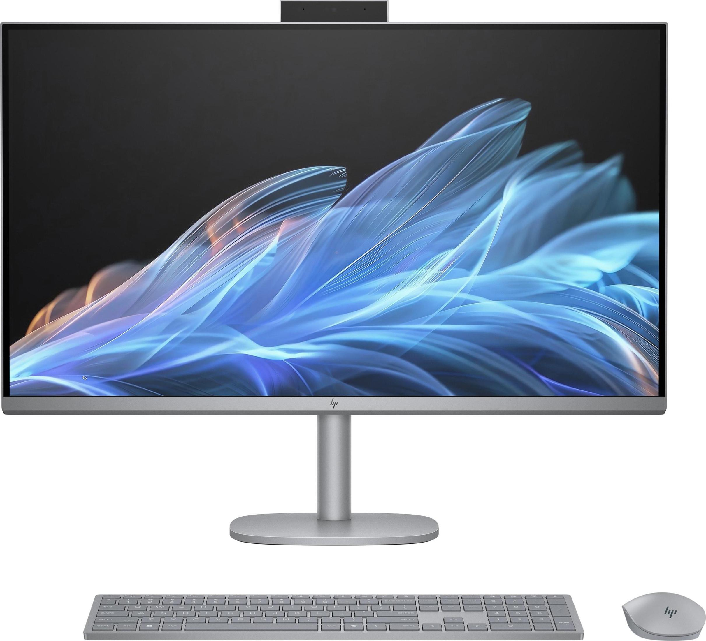 Silberner All-in-One-Computer mit Monitor, Tastatur und Maus. Er hat eine schwarze Webcam.
