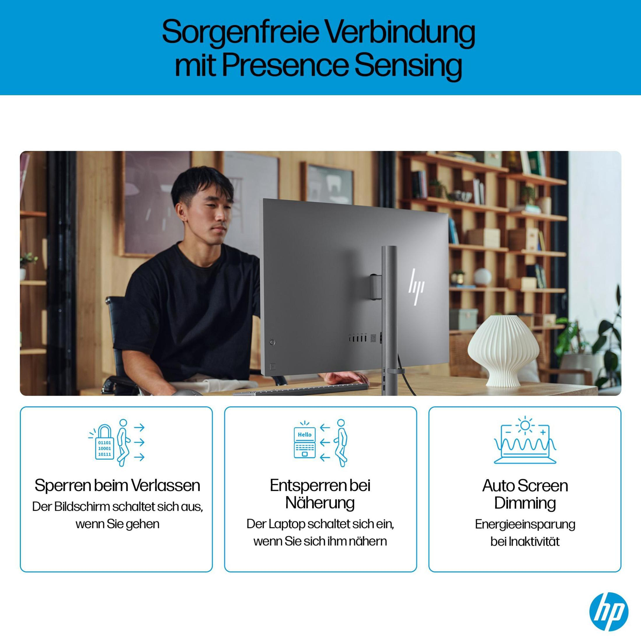 Mann arbeitet an einem Schreibtisch mit Computer; Diagramme der Sicherheitsmerkmale.